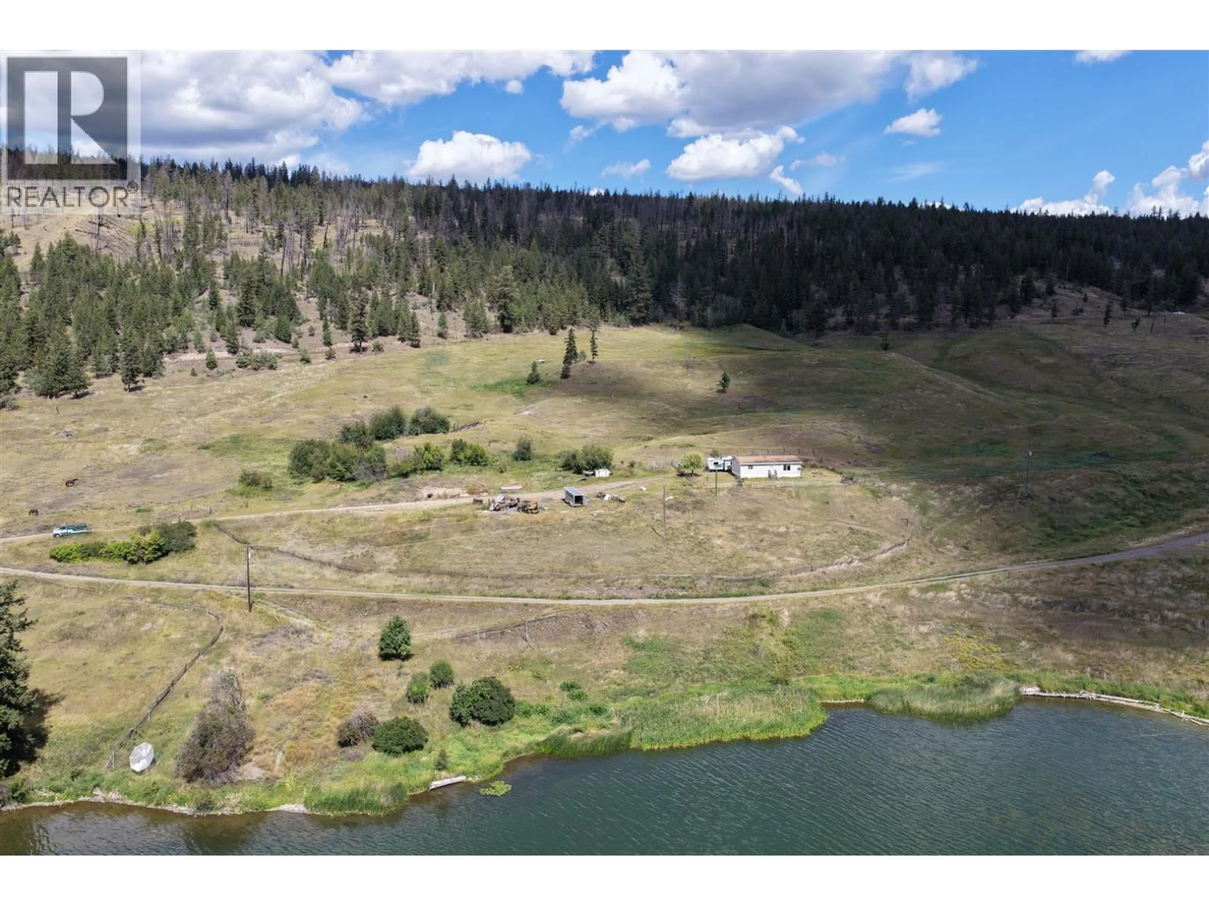 A pic from outside/outdoor area/front of a property/back of a property/a pic from drone, water/lake/river/ocean view for 3850 LOON LAKE ROAD, Loon Lake British Columbia V0K2E1