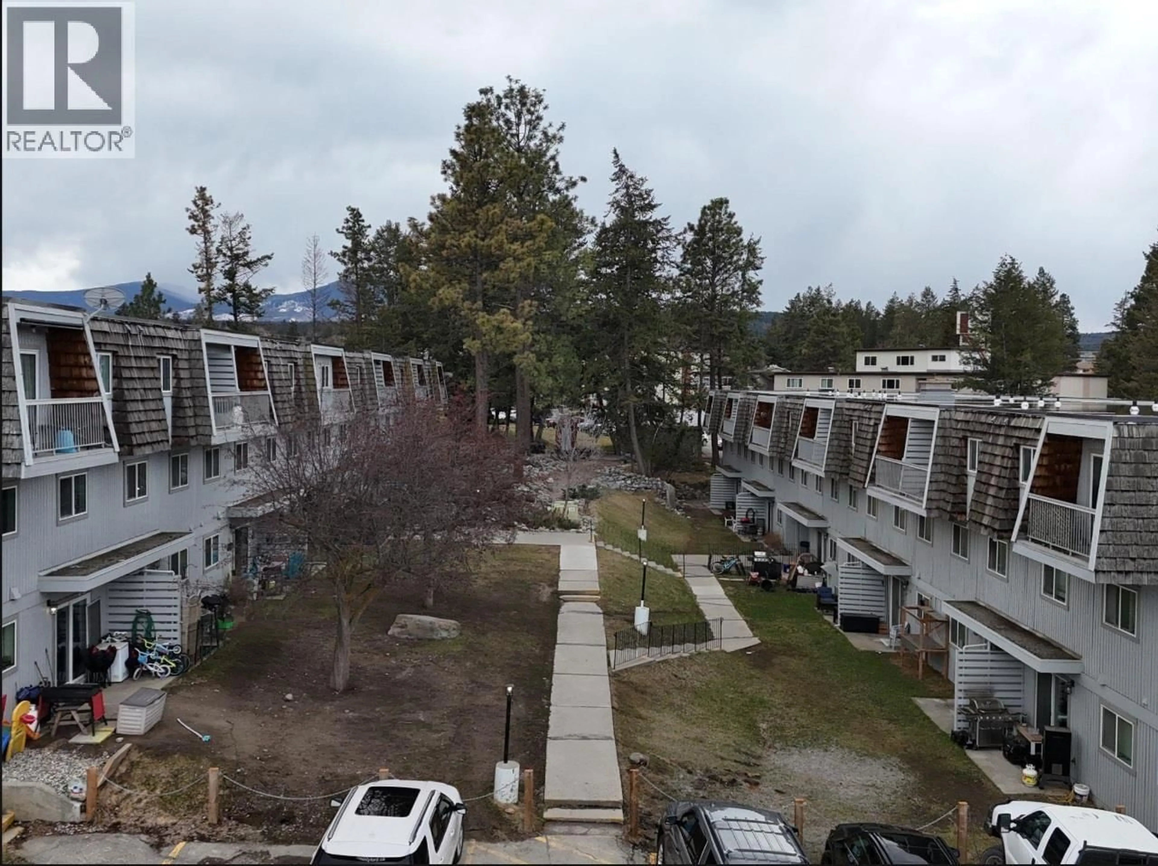 A pic from outside/outdoor area/front of a property/back of a property/a pic from drone, mountain view for 207 - 2117 2ND STREET NORTH, Cranbrook British Columbia V1C3L4