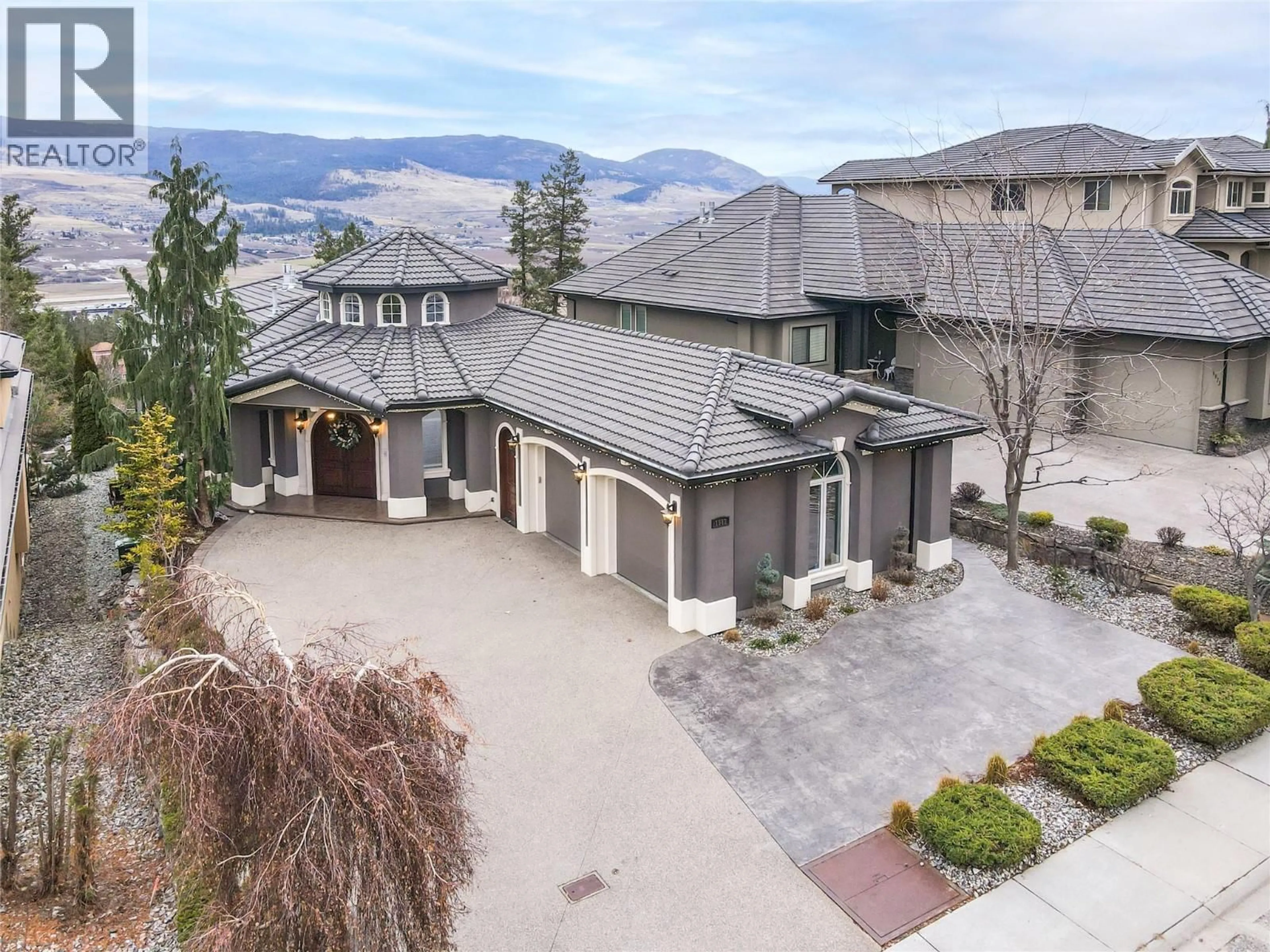 A pic from outside/outdoor area/front of a property/back of a property/a pic from drone, mountain view for 1981 CAPISTRANO DRIVE, Kelowna British Columbia V1V2N1