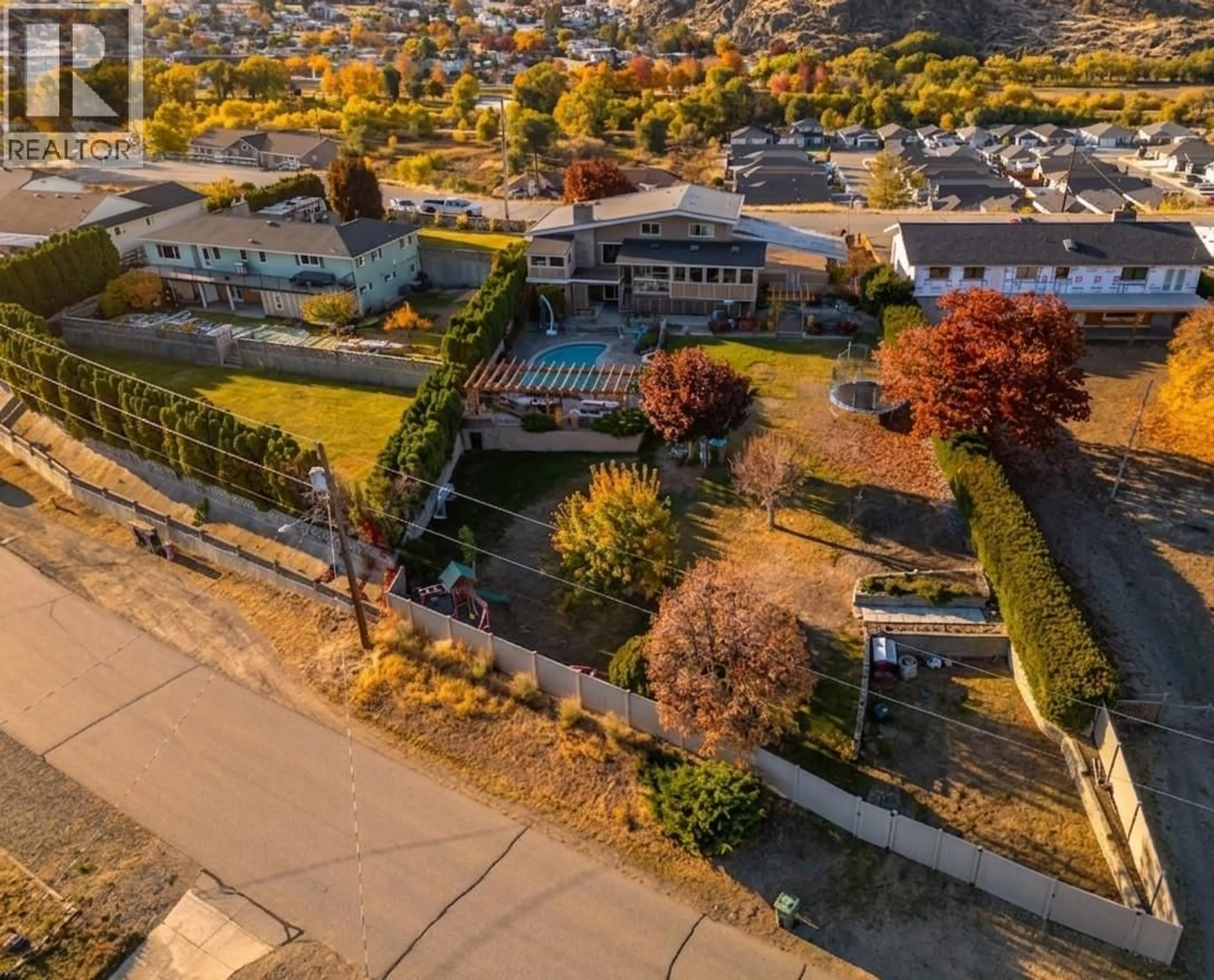 A pic from outside/outdoor area/front of a property/back of a property/a pic from drone, city buildings view from balcony for 6521 BELLEVUE DRIVE, Oliver British Columbia V0H1T4