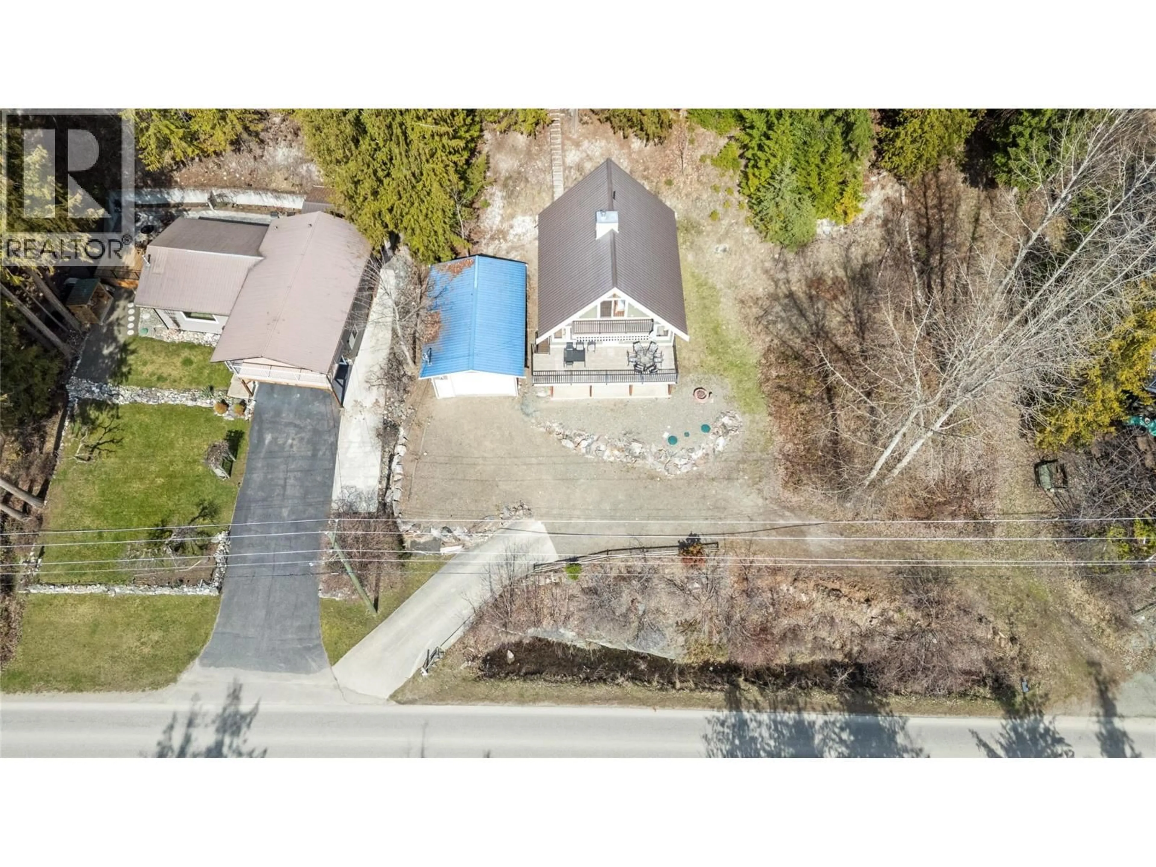 A pic from outside/outdoor area/front of a property/back of a property/a pic from drone, street for 7577 SQUILAX ANGLEMONT ROAD, Anglemont British Columbia V0E1M8
