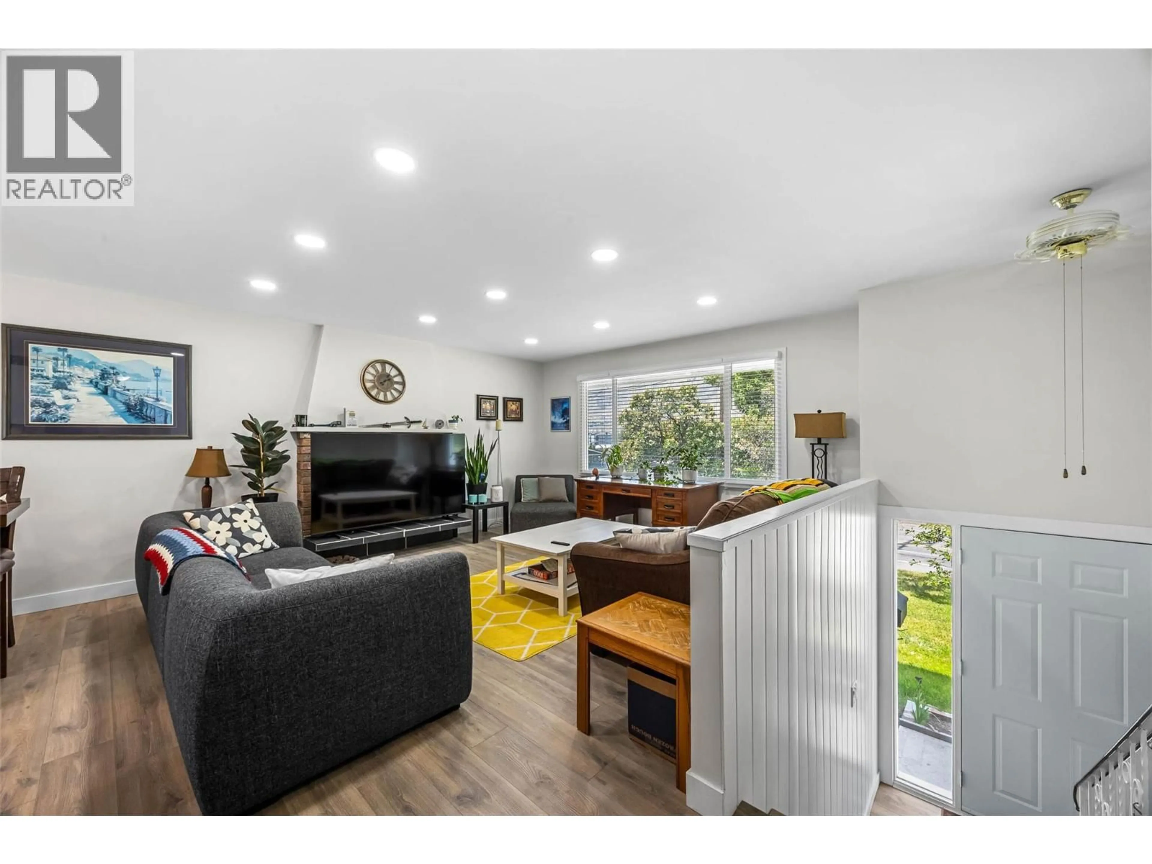 Living room with furniture, wood/laminate floor for 2103 VALLEYVIEW DRIVE, Kamloops British Columbia V2C4C3