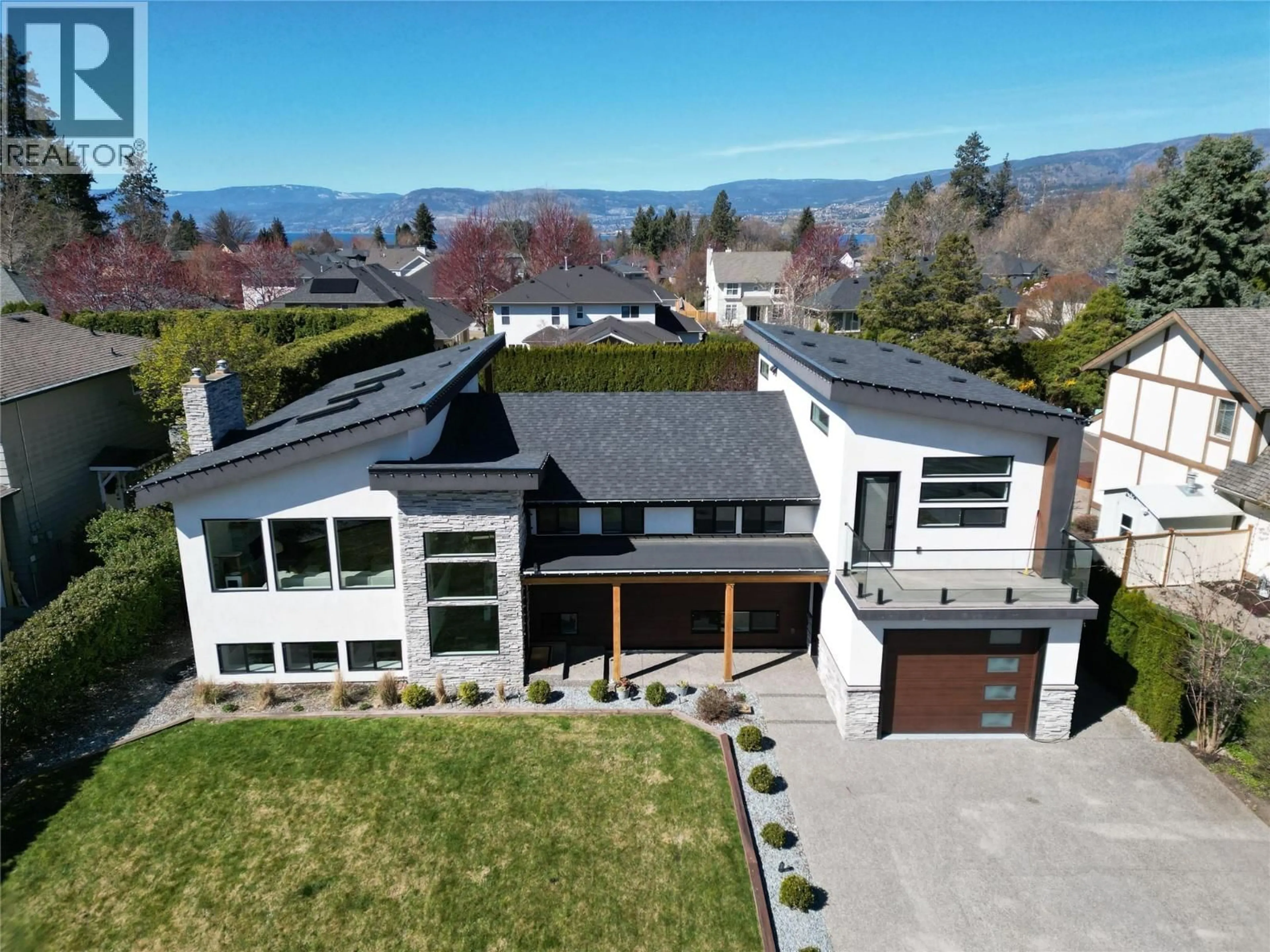 A pic from outside/outdoor area/front of a property/back of a property/a pic from drone, mountain view for 4354 KENSINGTON DRIVE, Kelowna British Columbia V1W2L8