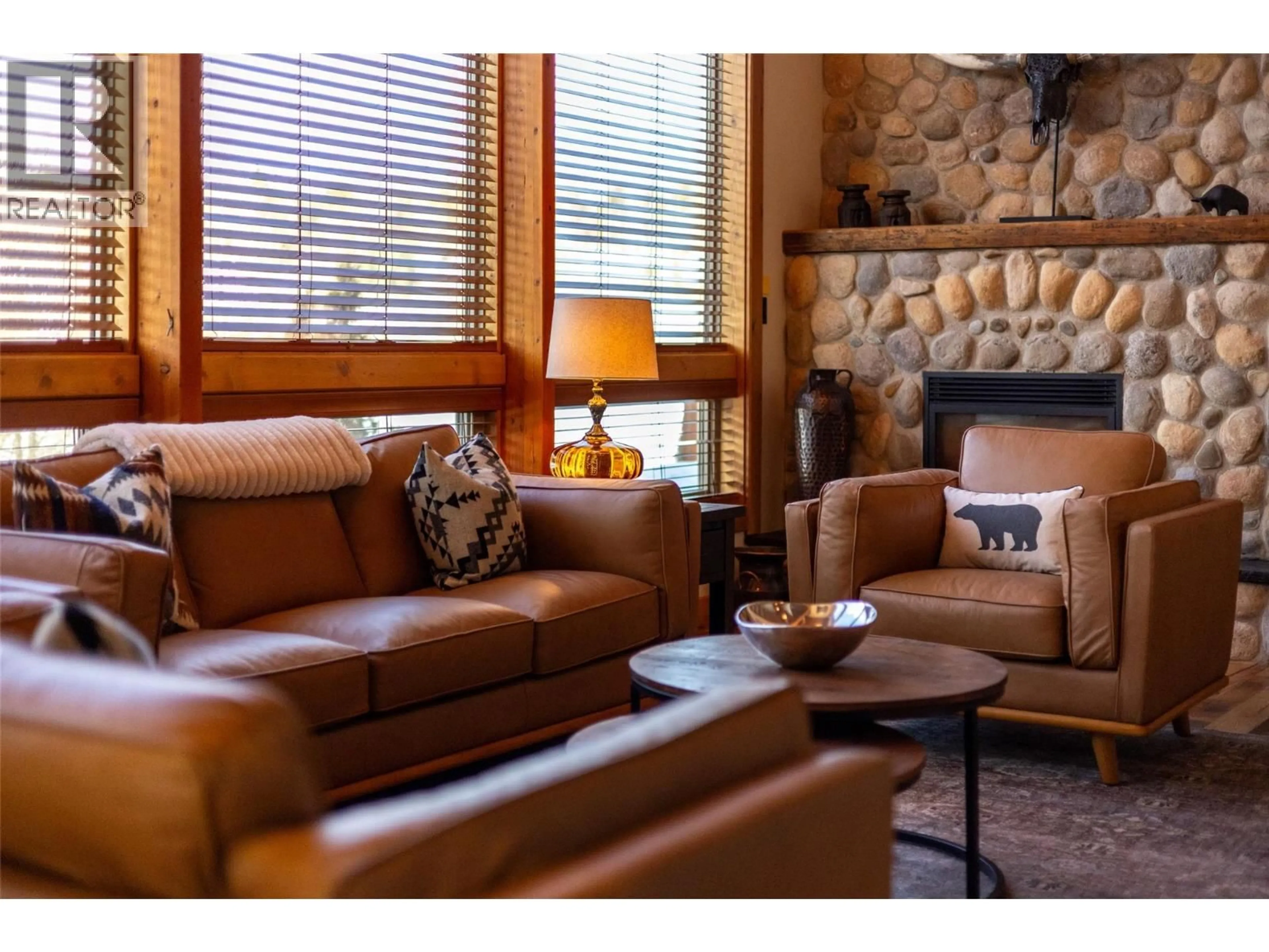 Living room with furniture, wood/laminate floor for 4061 HILL ROAD, Fernie British Columbia V0B1M4