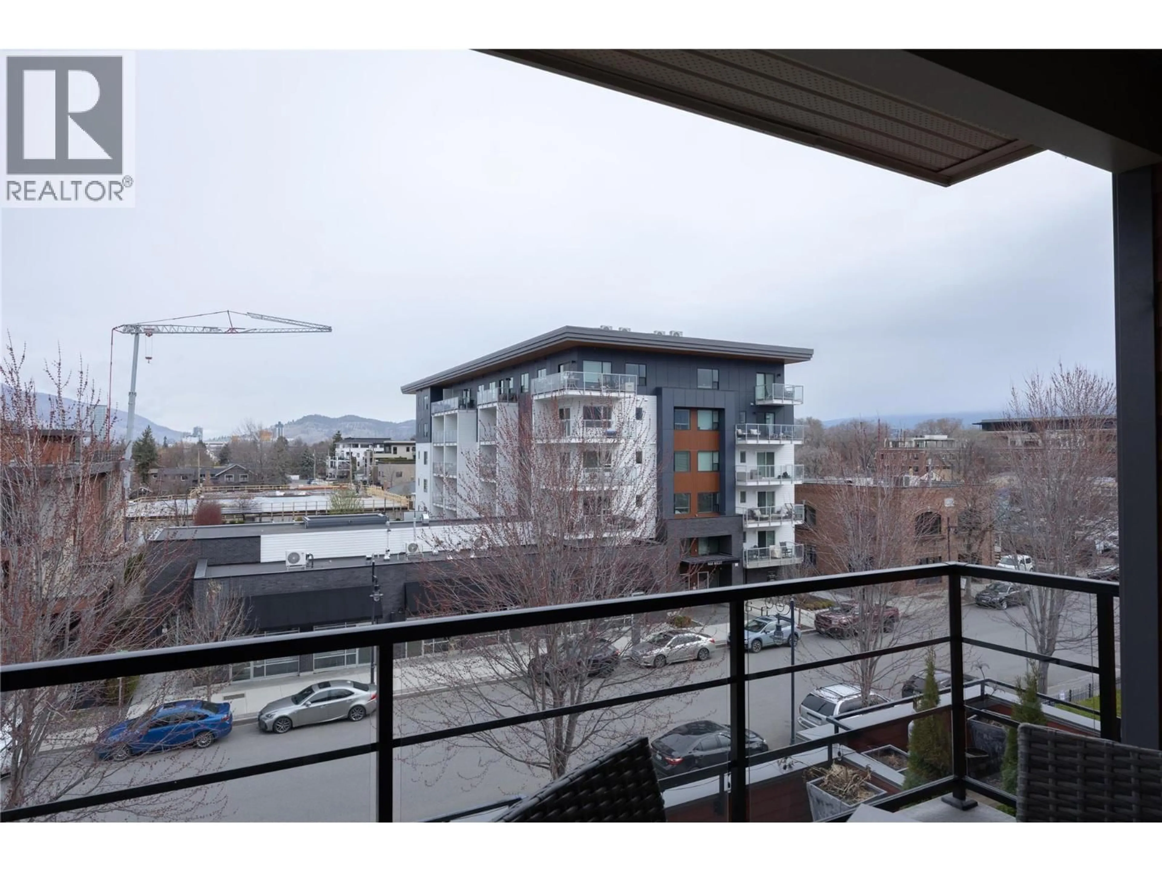 Balcony in the apartment, city buildings view from balcony for 307 - 457 WEST AVENUE, Kelowna British Columbia V1Y4Z3