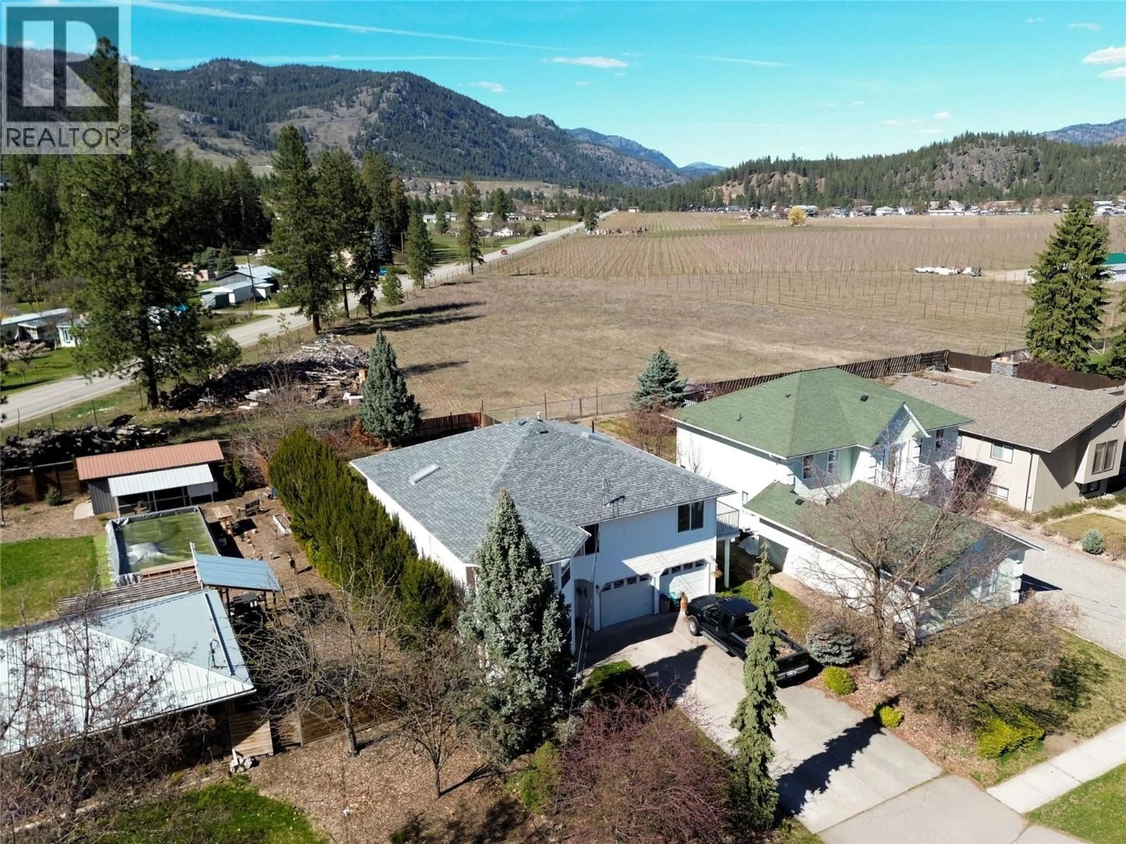 A pic from outside/outdoor area/front of a property/back of a property/a pic from drone, mountain view for 2859 75TH AVENUE, Grand Forks British Columbia V0H1H2