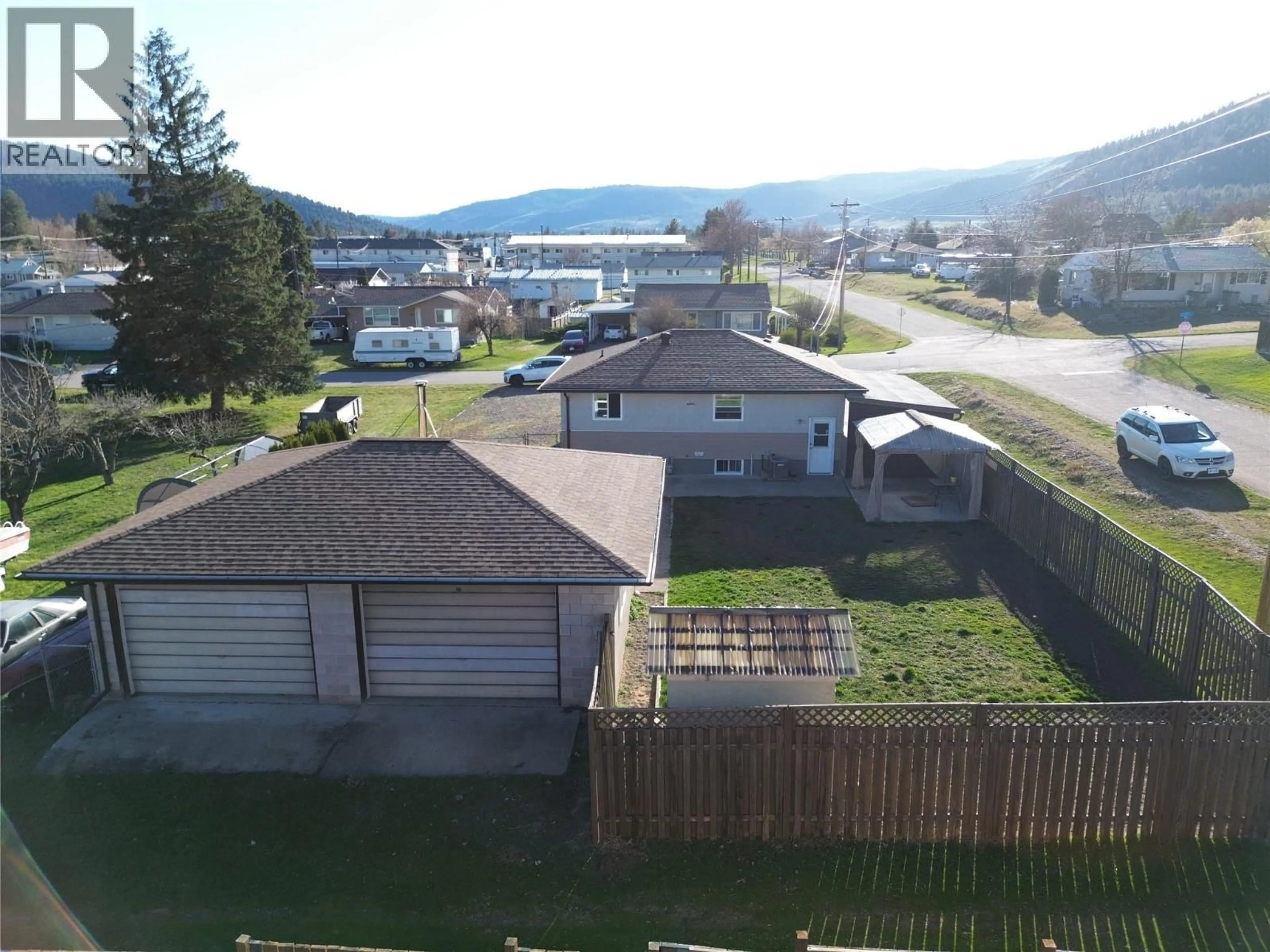 A pic from outside/outdoor area/front of a property/back of a property/a pic from drone, mountain view for 6980 17TH STREET, Grand Forks British Columbia V0H1H0
