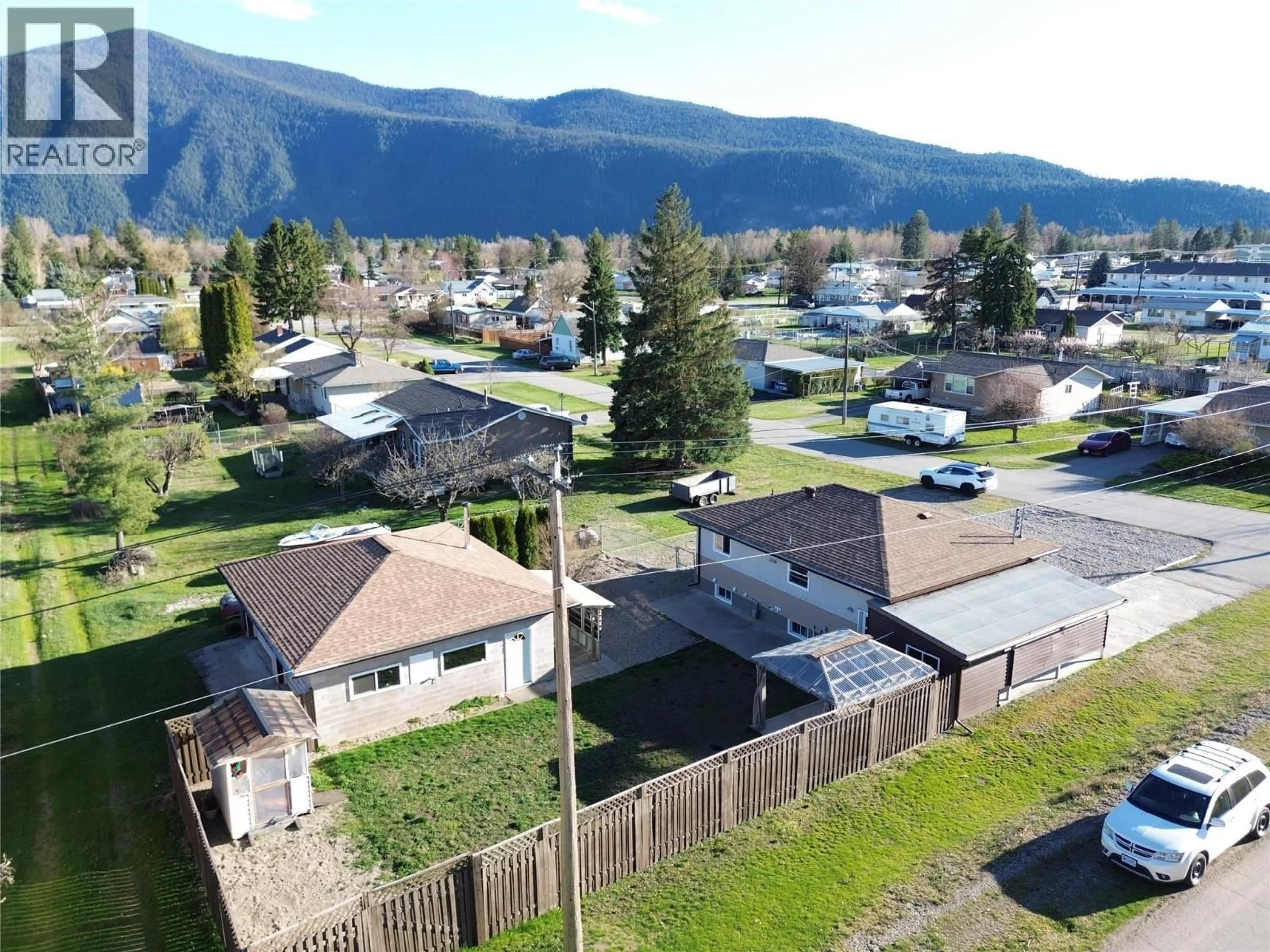 A pic from outside/outdoor area/front of a property/back of a property/a pic from drone, mountain view for 6980 17TH STREET, Grand Forks British Columbia V0H1H0