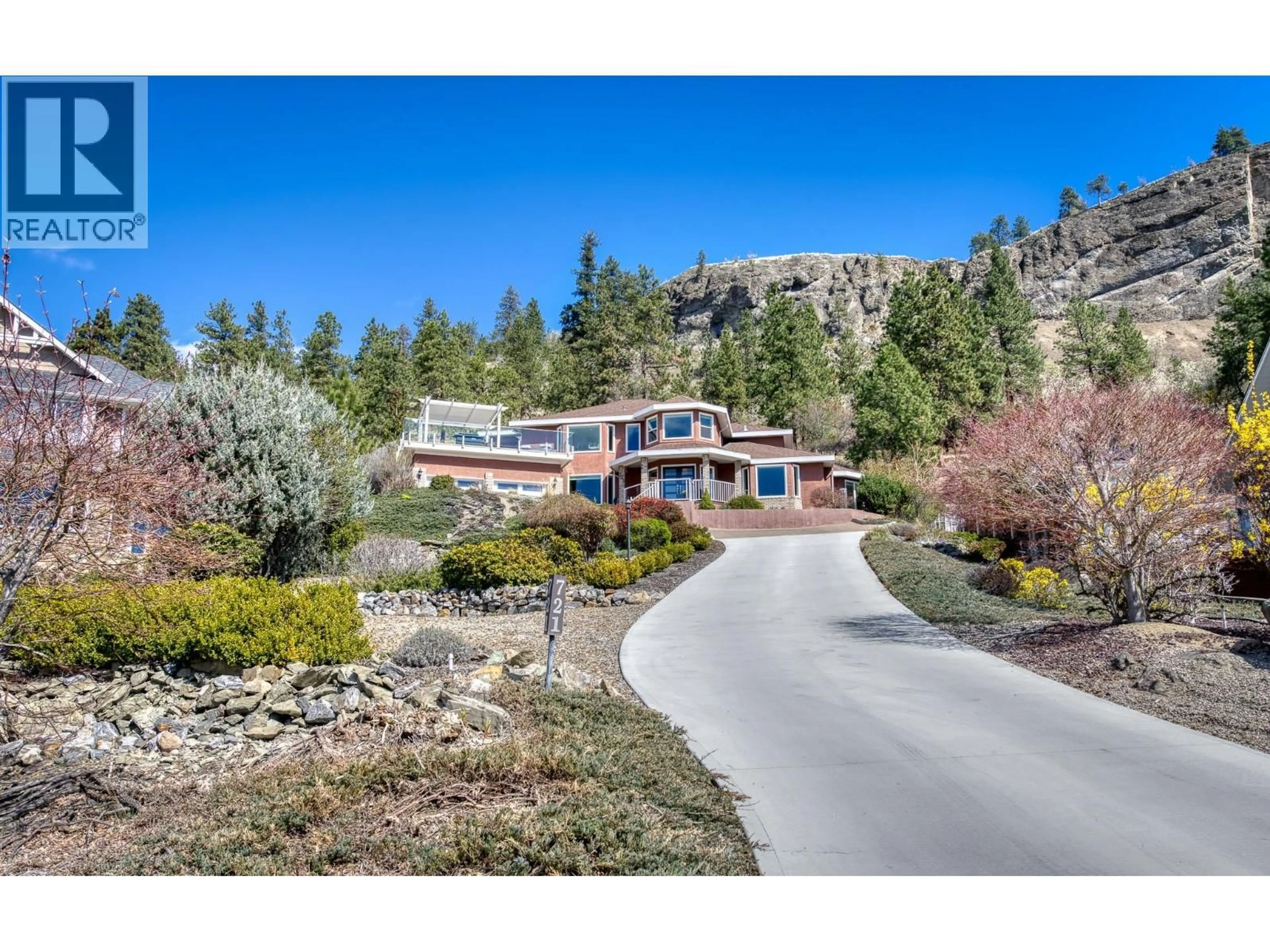 A pic from outside/outdoor area/front of a property/back of a property/a pic from drone, mountain view for 721 ROYAL PINE DRIVE, Kelowna British Columbia V1Y9G2