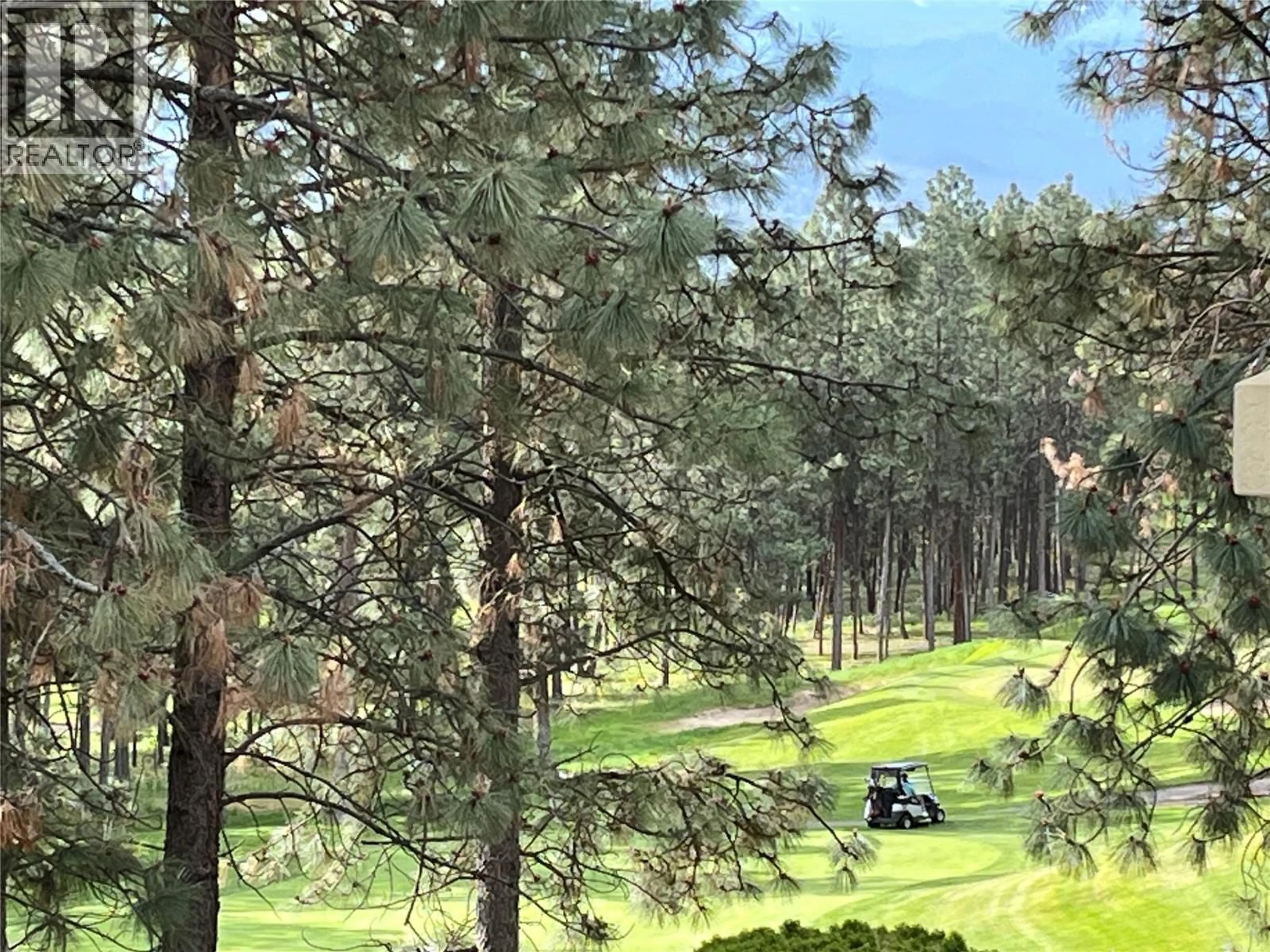 A pic from outside/outdoor area/front of a property/back of a property/a pic from drone, forest/trees view for 203 - 3179 VIA CENTRALE ROAD, Kelowna British Columbia V1V2J5