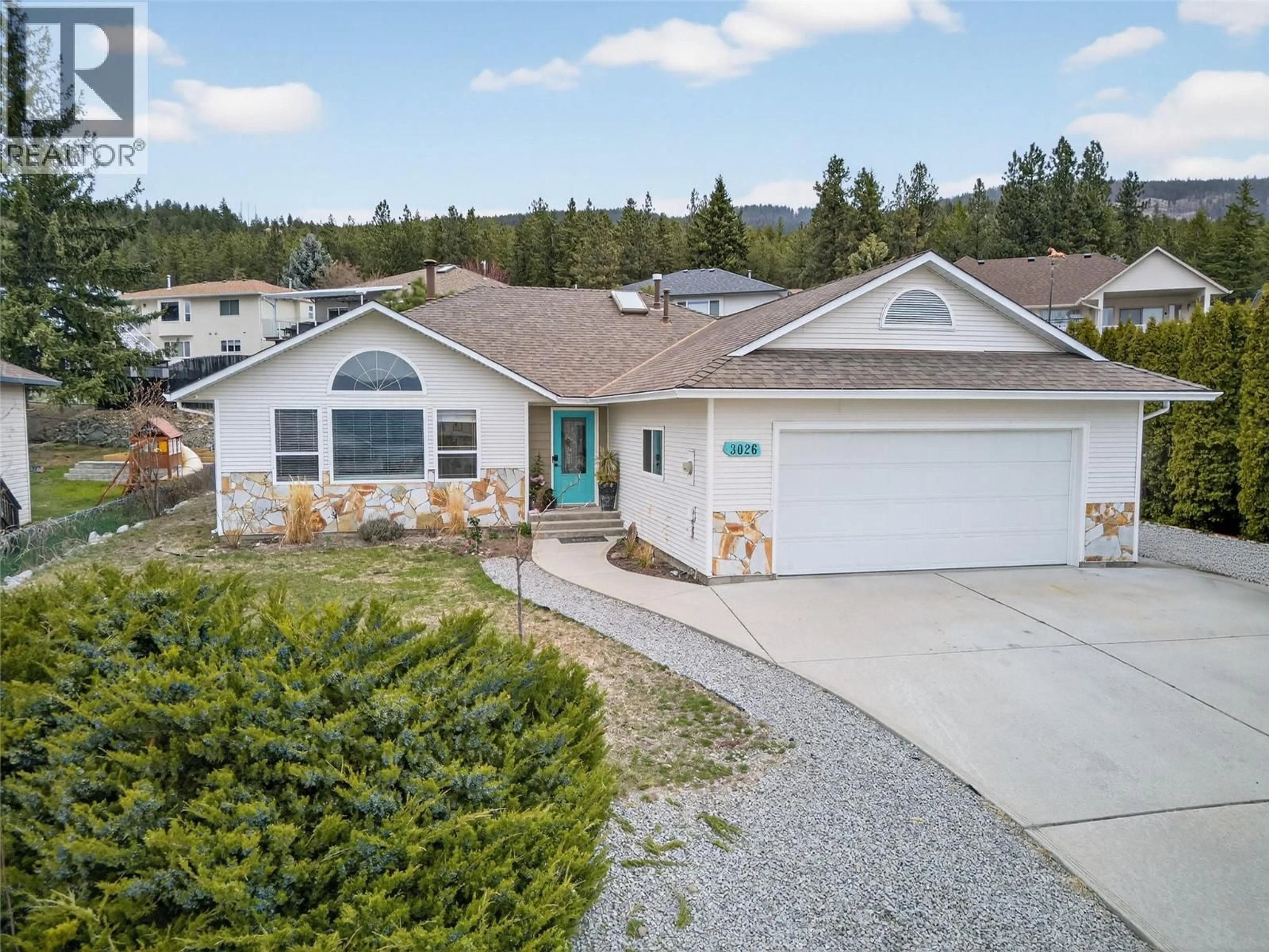 Home with vinyl exterior material, street for 3026 WHISPERING HILLS DRIVE, West Kelowna British Columbia V4T2M9