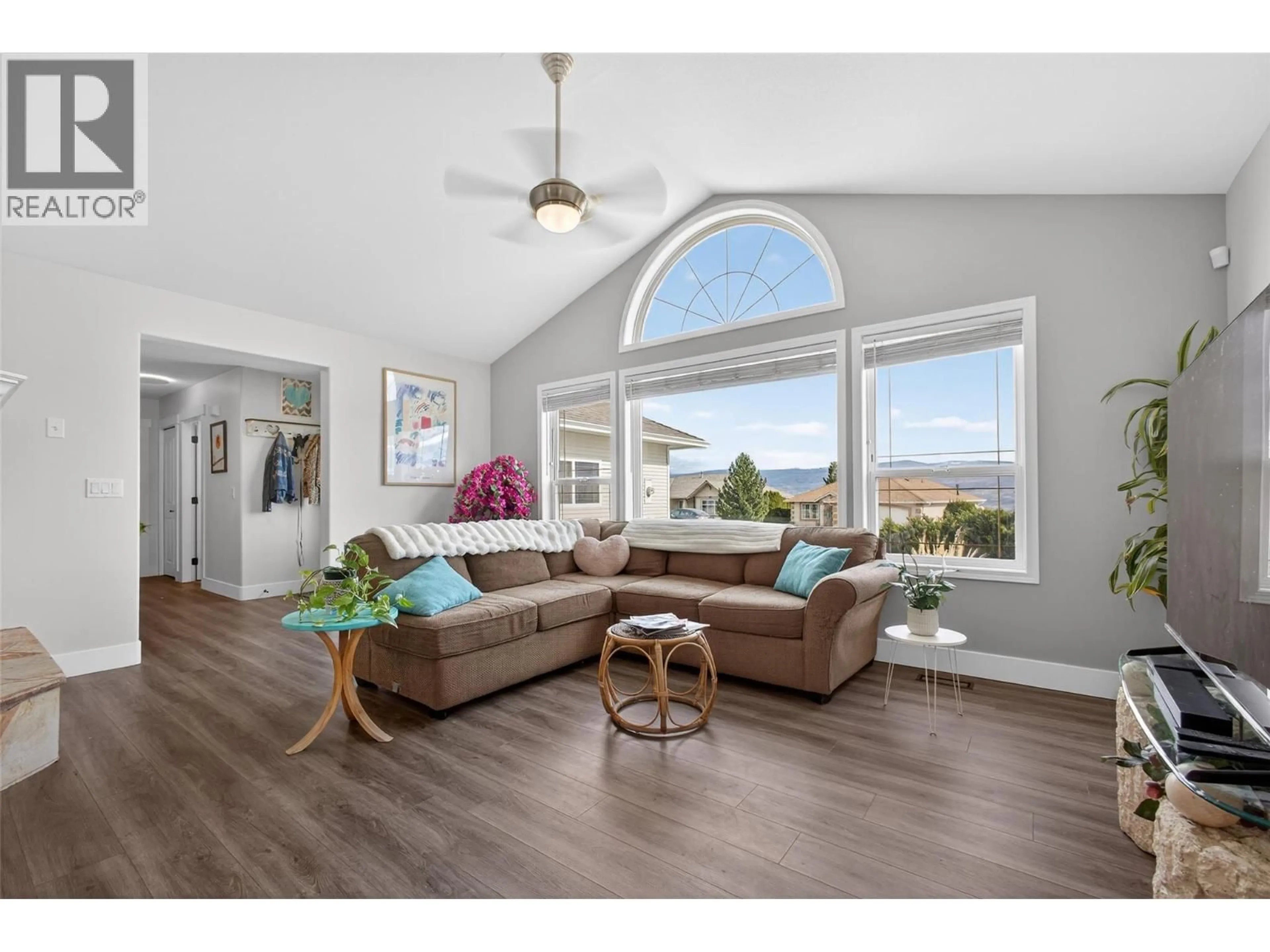 Living room with furniture, wood/laminate floor for 3026 WHISPERING HILLS DRIVE, West Kelowna British Columbia V4T2M9