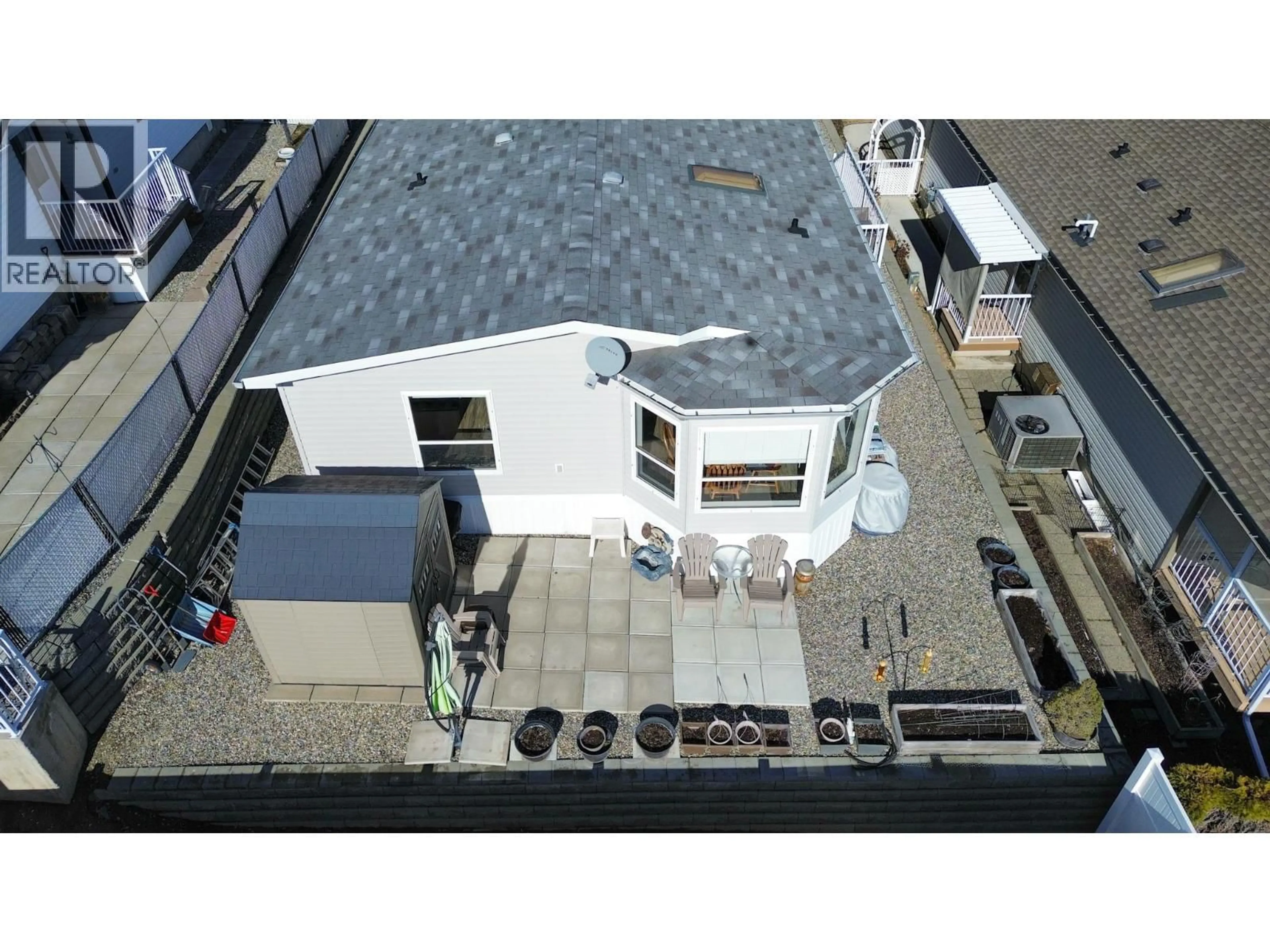 A pic from outside/outdoor area/front of a property/back of a property/a pic from drone, street for 22 - 9410 115TH STREET, Osoyoos British Columbia V0H1V5