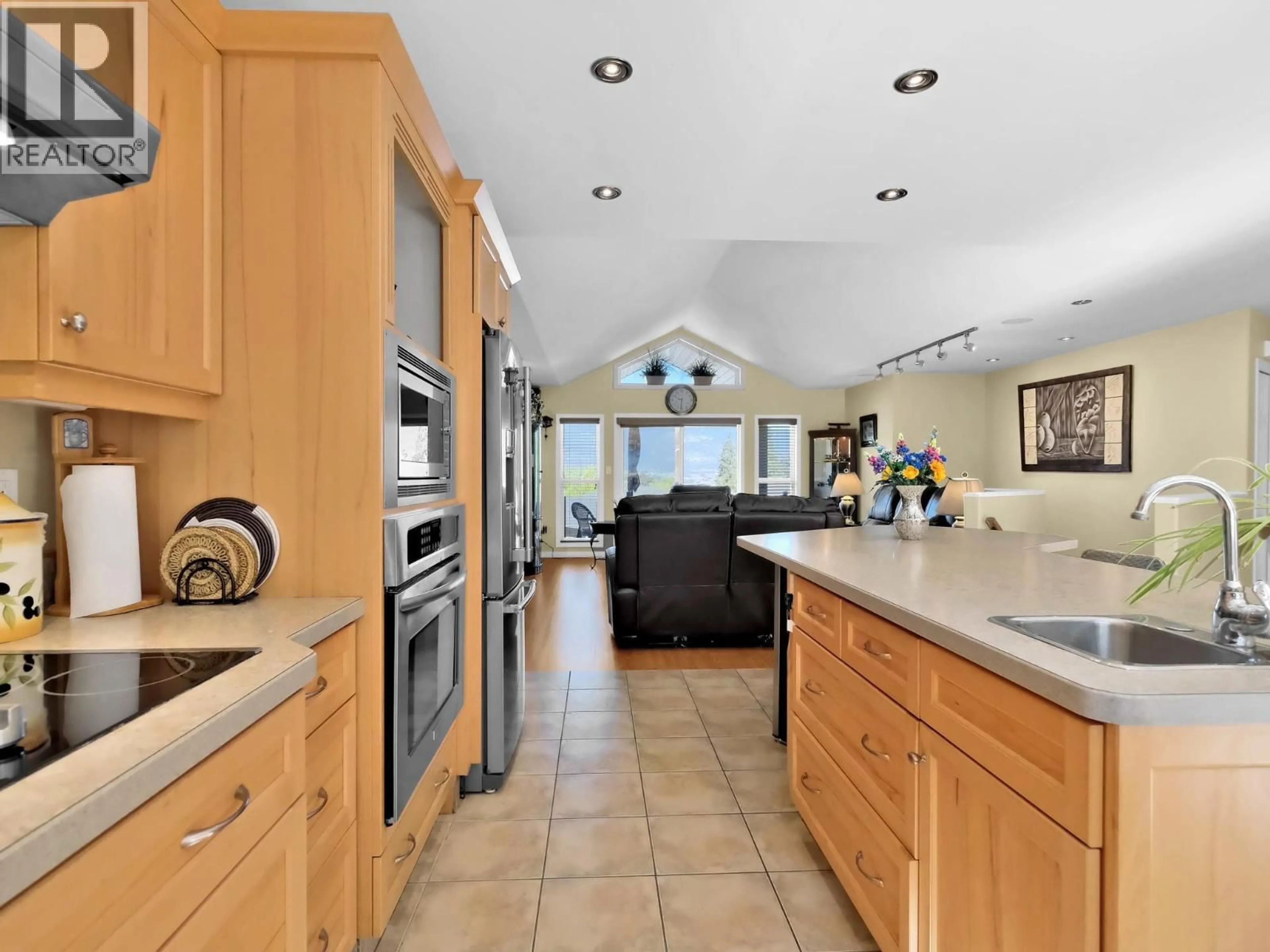 Open concept kitchen, ceramic/tile floor for 102 - 695 PINEVIEW ROAD, Penticton British Columbia V2A7S8