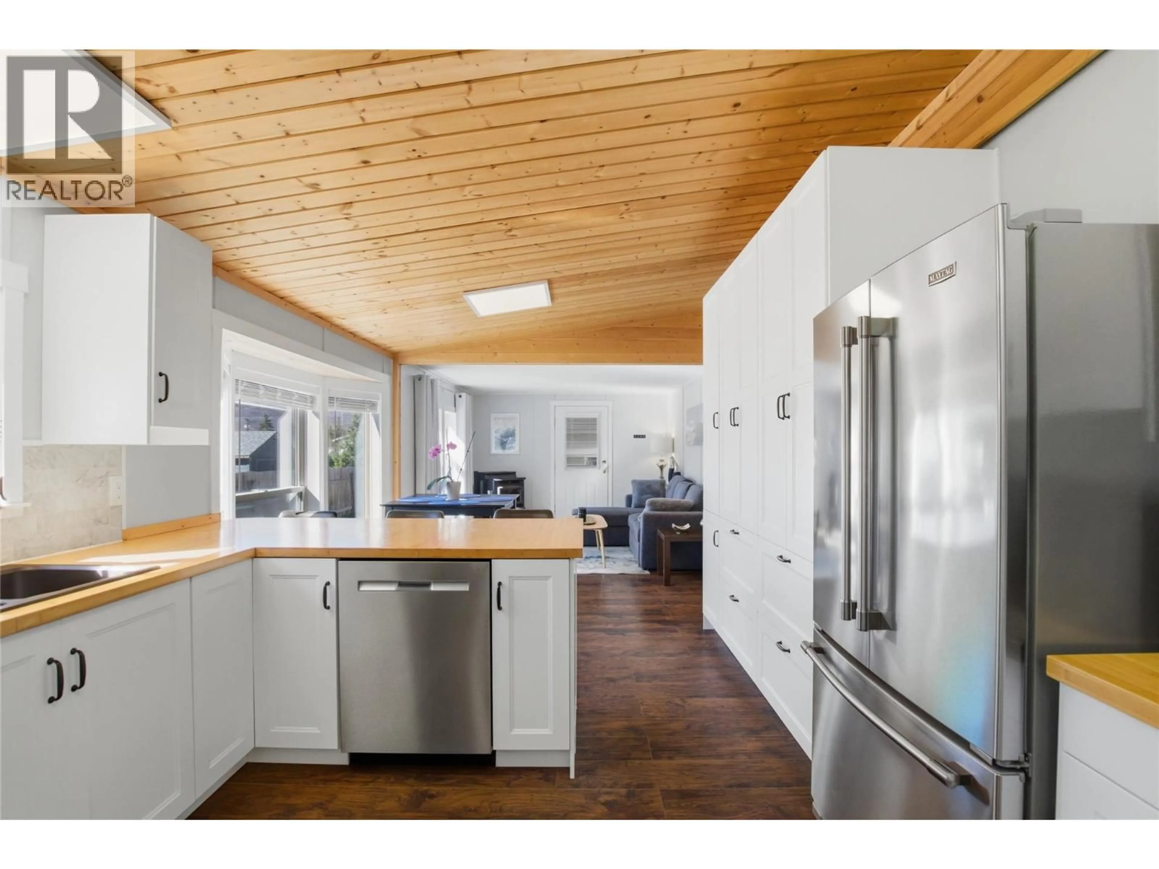 Open concept kitchen, wood/laminate floor for 4633 SPRUCE CRESCENT, Barriere British Columbia V1E1E0