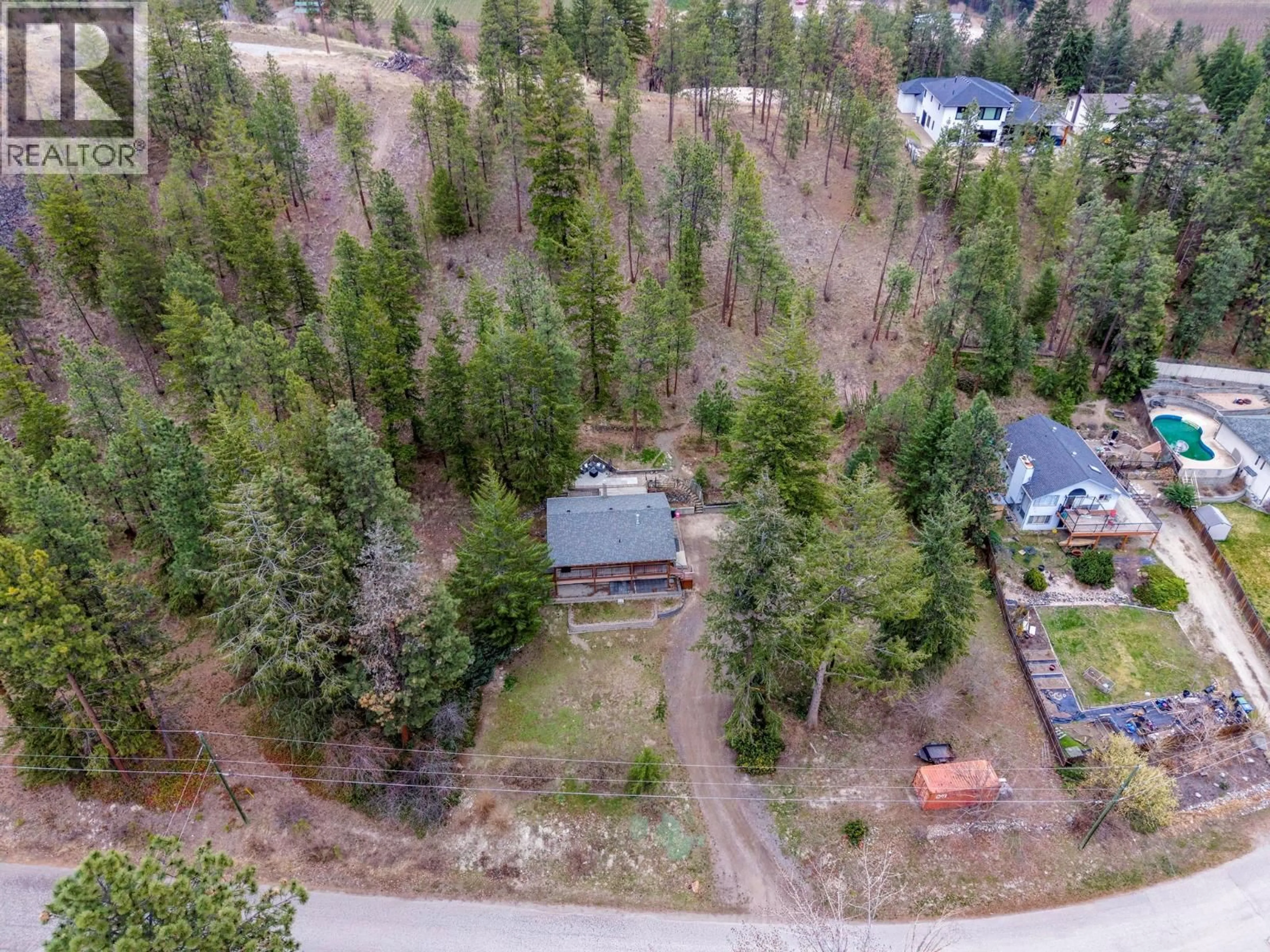 A pic from outside/outdoor area/front of a property/back of a property/a pic from drone, forest/trees view for 11011 HALLAM DRIVE, Lake Country British Columbia V4V1P2