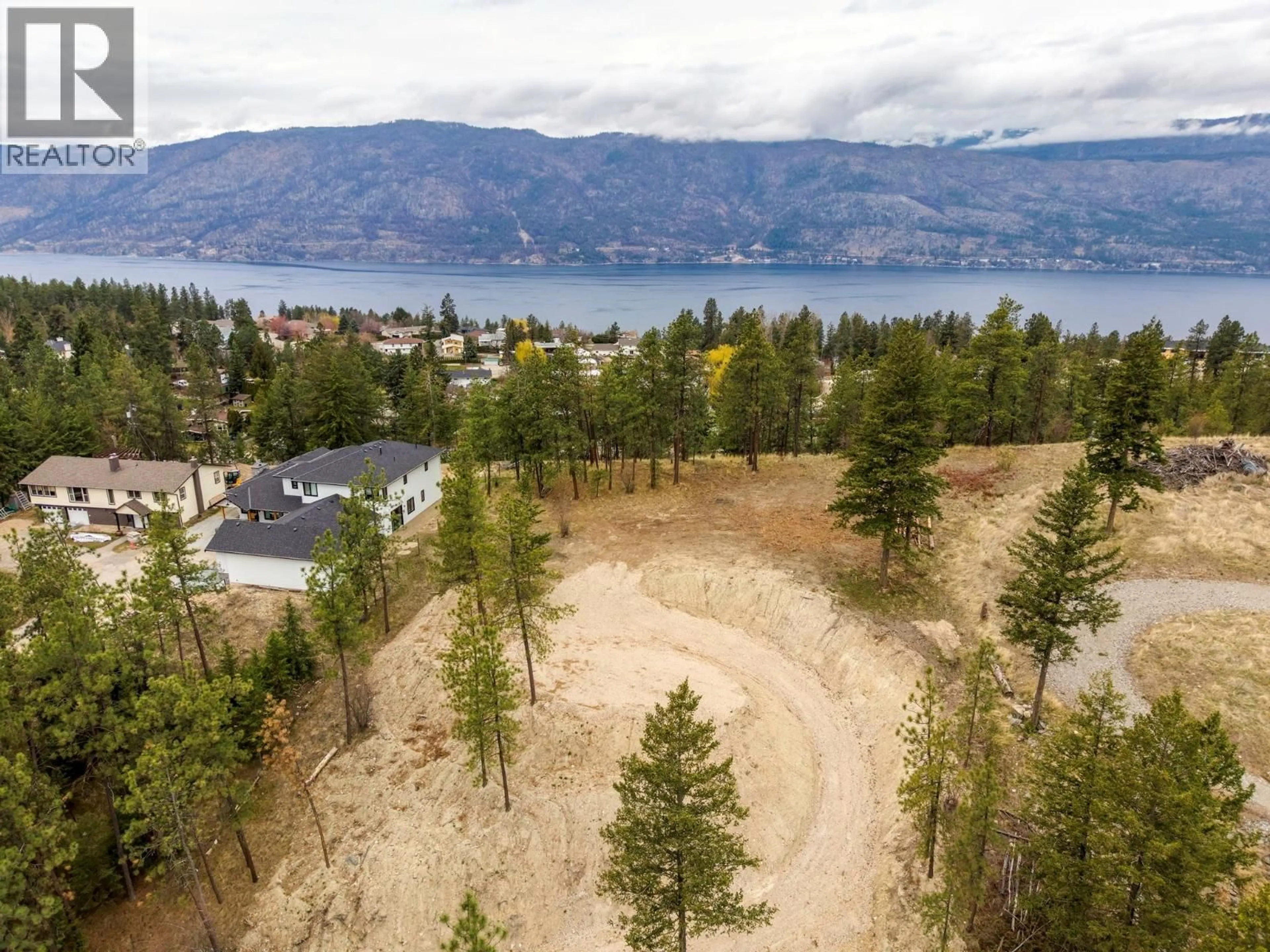 A pic from outside/outdoor area/front of a property/back of a property/a pic from drone, water/lake/river/ocean view for 11011 HALLAM DRIVE, Lake Country British Columbia V4V1P2