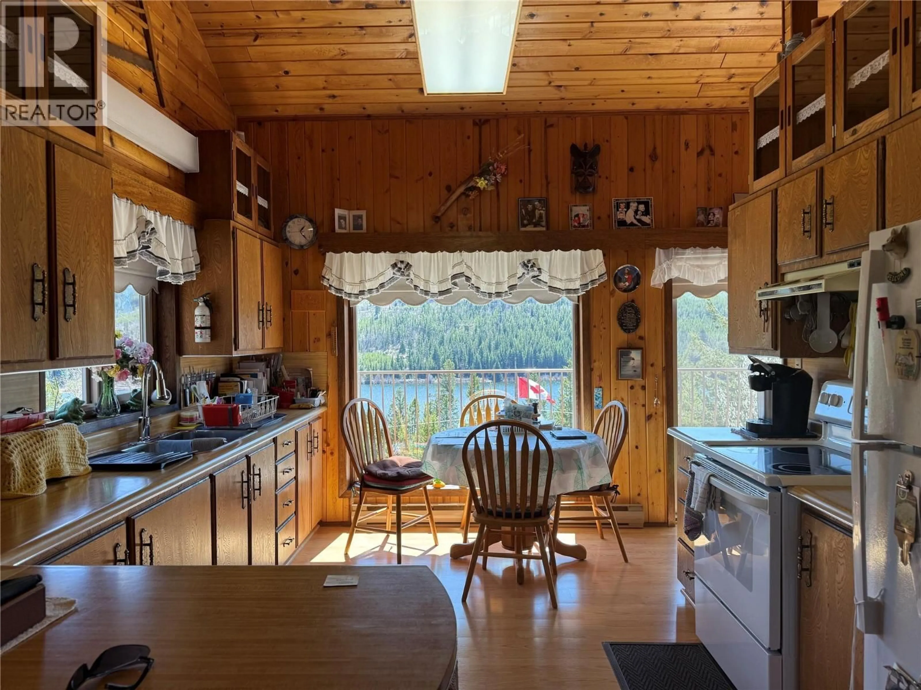 Rustic kitchen, wood/laminate floor for 4158 PRINCETON SUMMERLAND ROAD, Princeton British Columbia V0X1W0