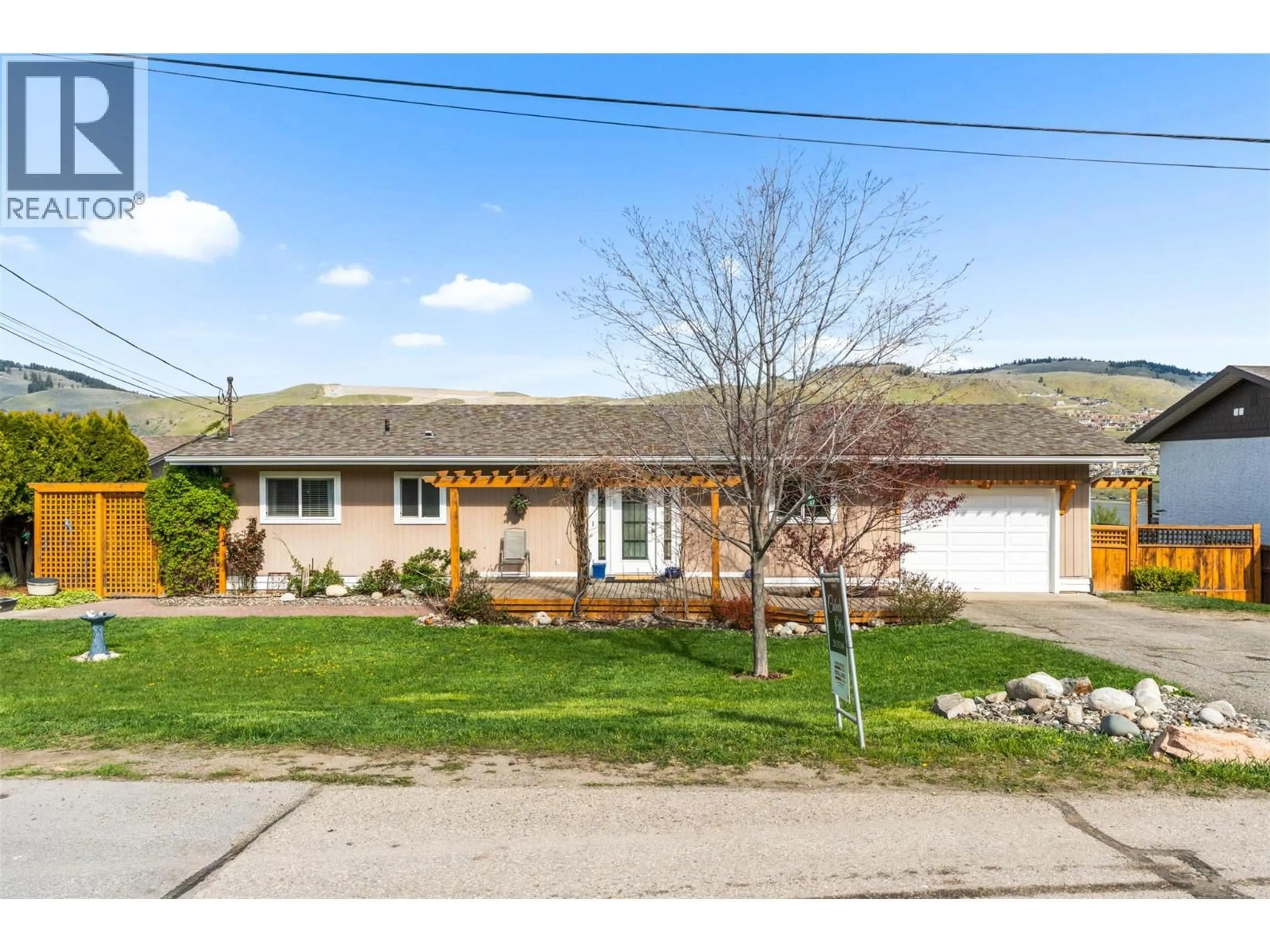 Home with vinyl exterior material, street for 7339 LONGACRE DRIVE, Vernon British Columbia V1H1H5