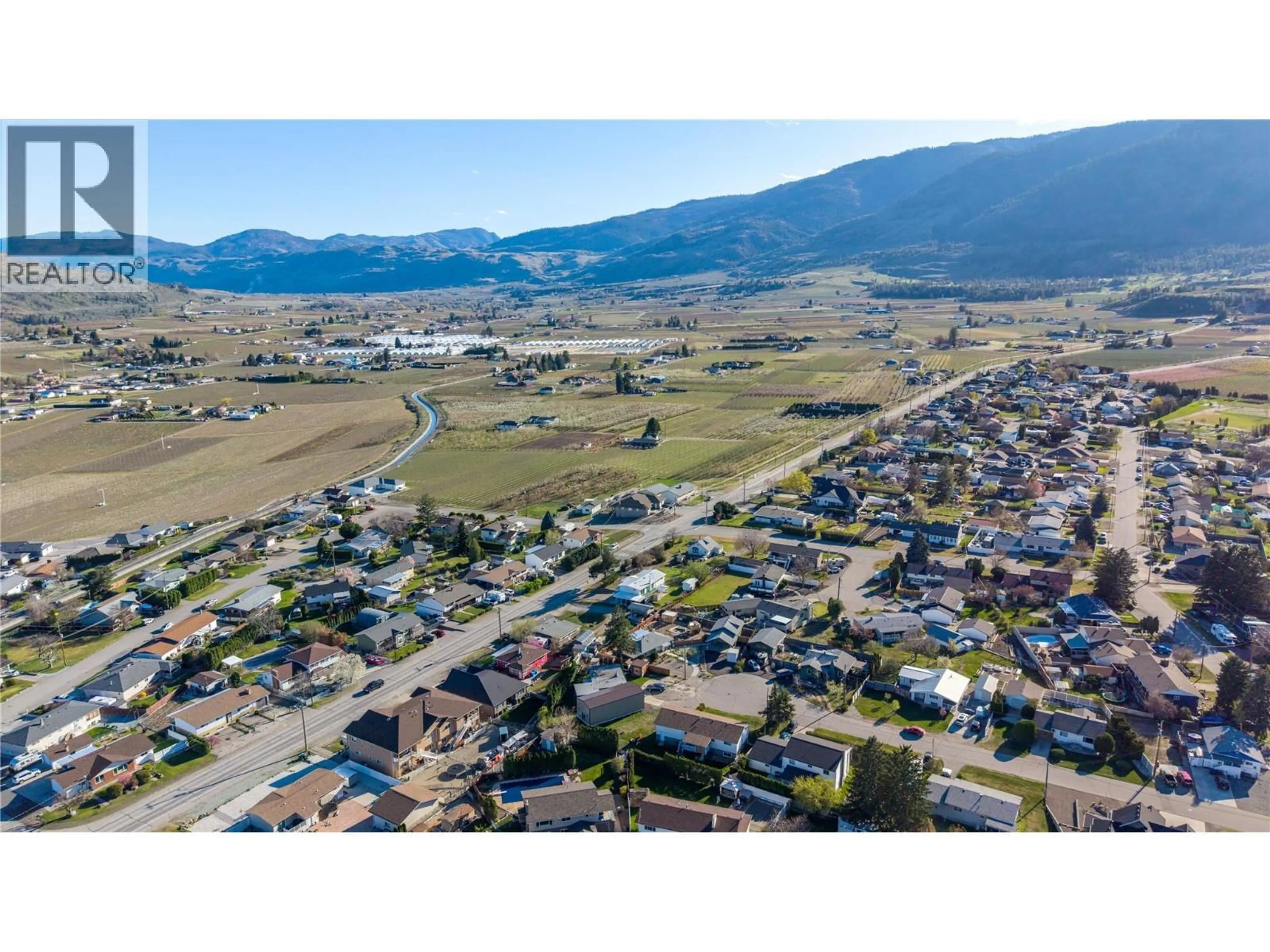 A pic from outside/outdoor area/front of a property/back of a property/a pic from drone, mountain view for 5900 SHAMROCK PLACE, Oliver British Columbia V0H1T6