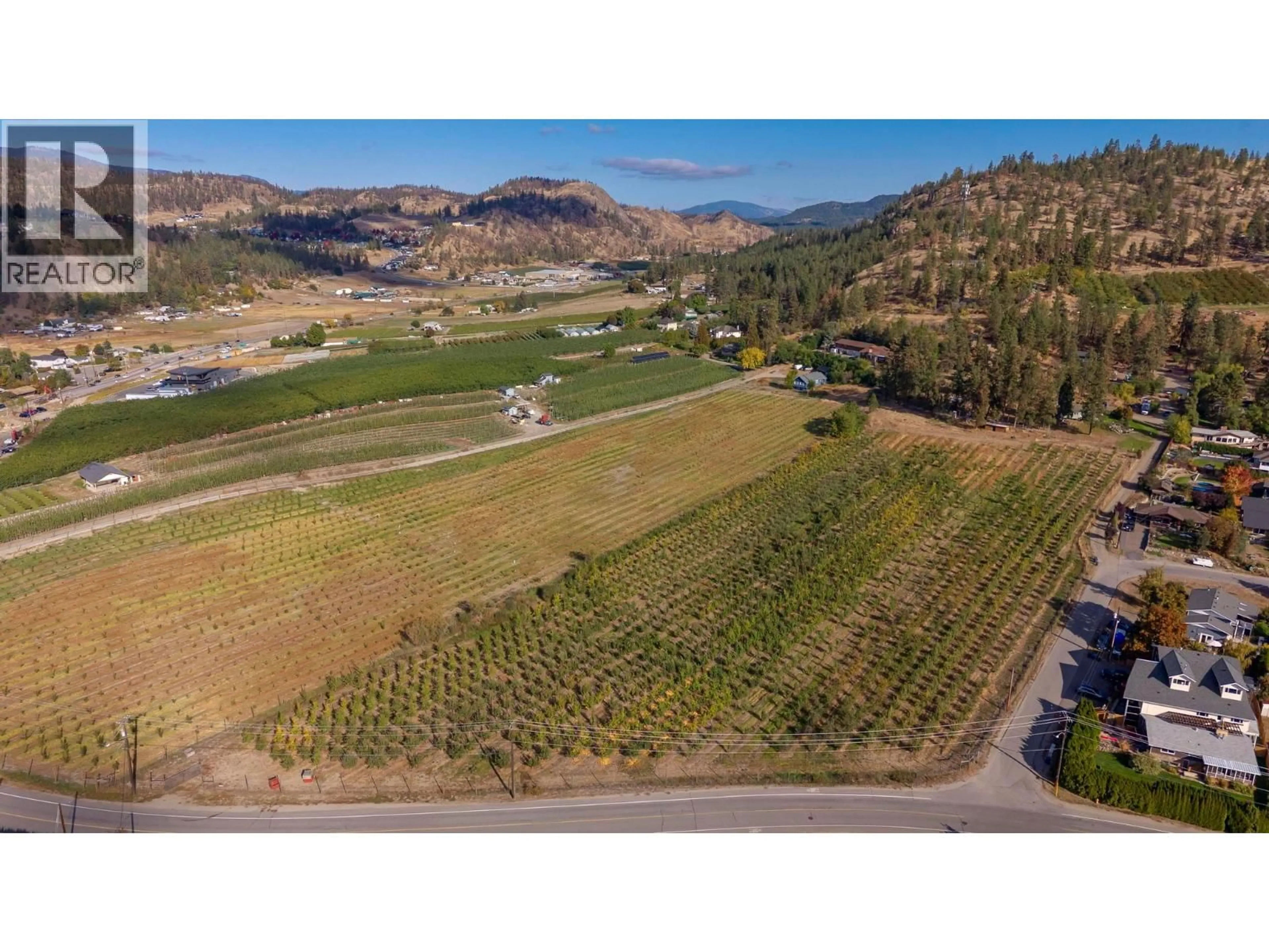 A pic from outside/outdoor area/front of a property/back of a property/a pic from drone, mountain view for 590 BRENDA ROAD, Kelowna British Columbia V1V2C8