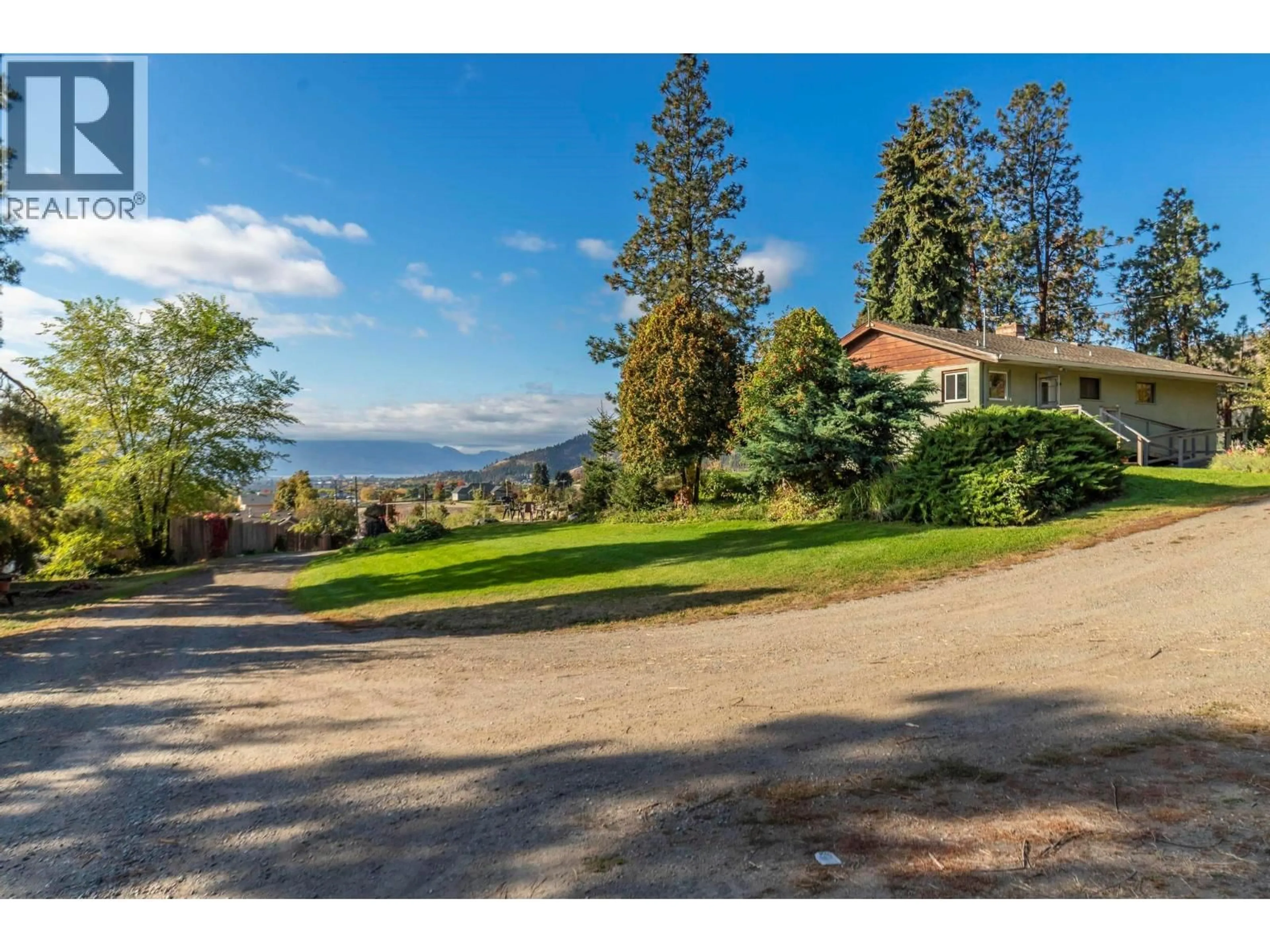 A pic from outside/outdoor area/front of a property/back of a property/a pic from drone, water/lake/river/ocean view for 590 BRENDA ROAD, Kelowna British Columbia V1V2C8
