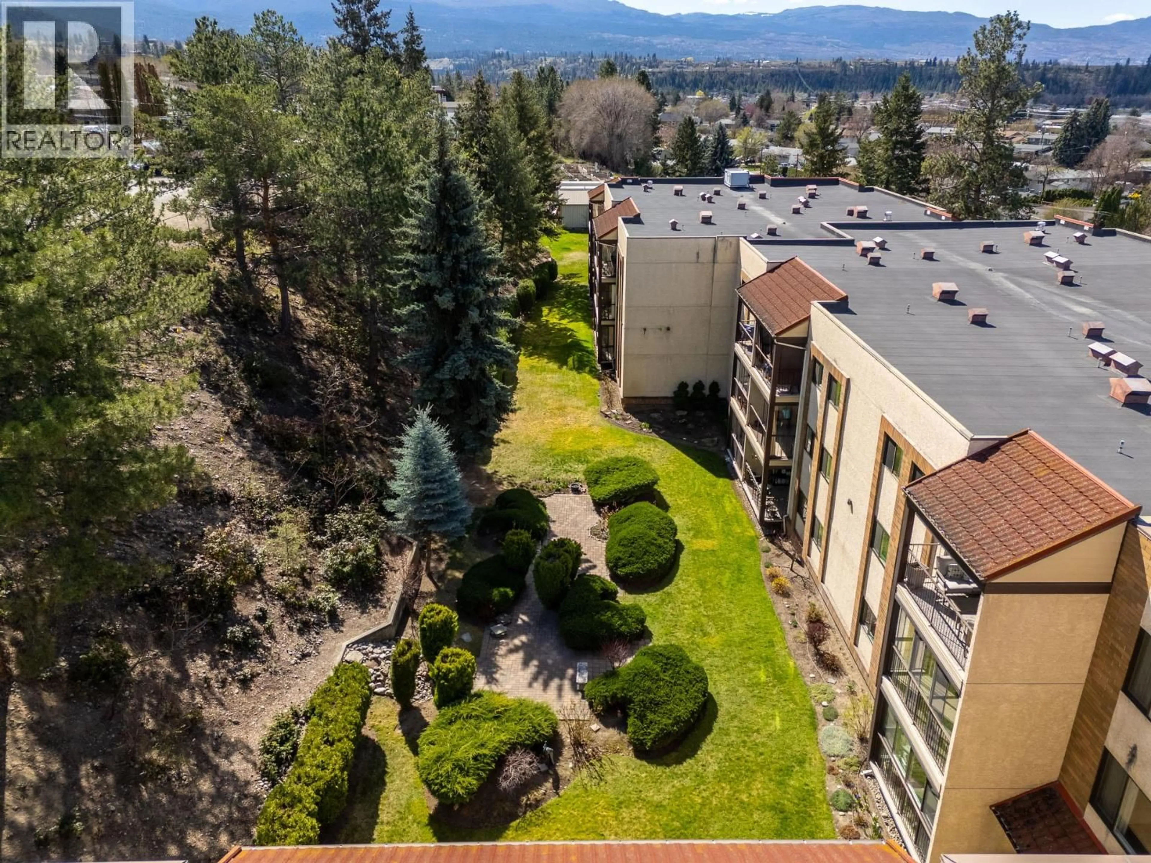 A pic from outside/outdoor area/front of a property/back of a property/a pic from drone, mountain view for 309 - 489 HIGHWAY 33 OTHER WEST, Kelowna British Columbia V1X1Y2