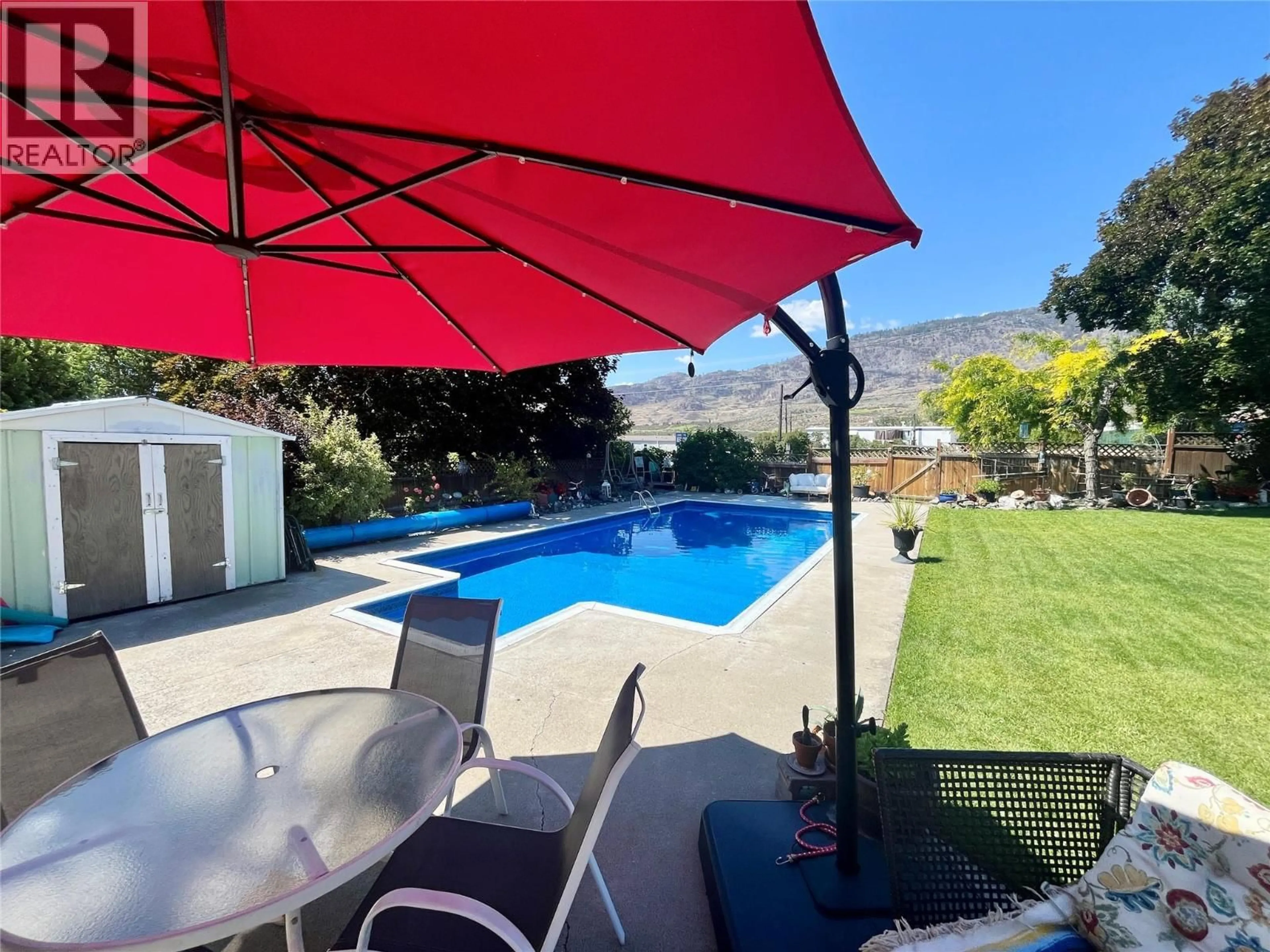 A pic from outside/outdoor area/front of a property/back of a property/a pic from drone, unknown for 20 FINCH CRESCENT, Osoyoos British Columbia V0H1V2