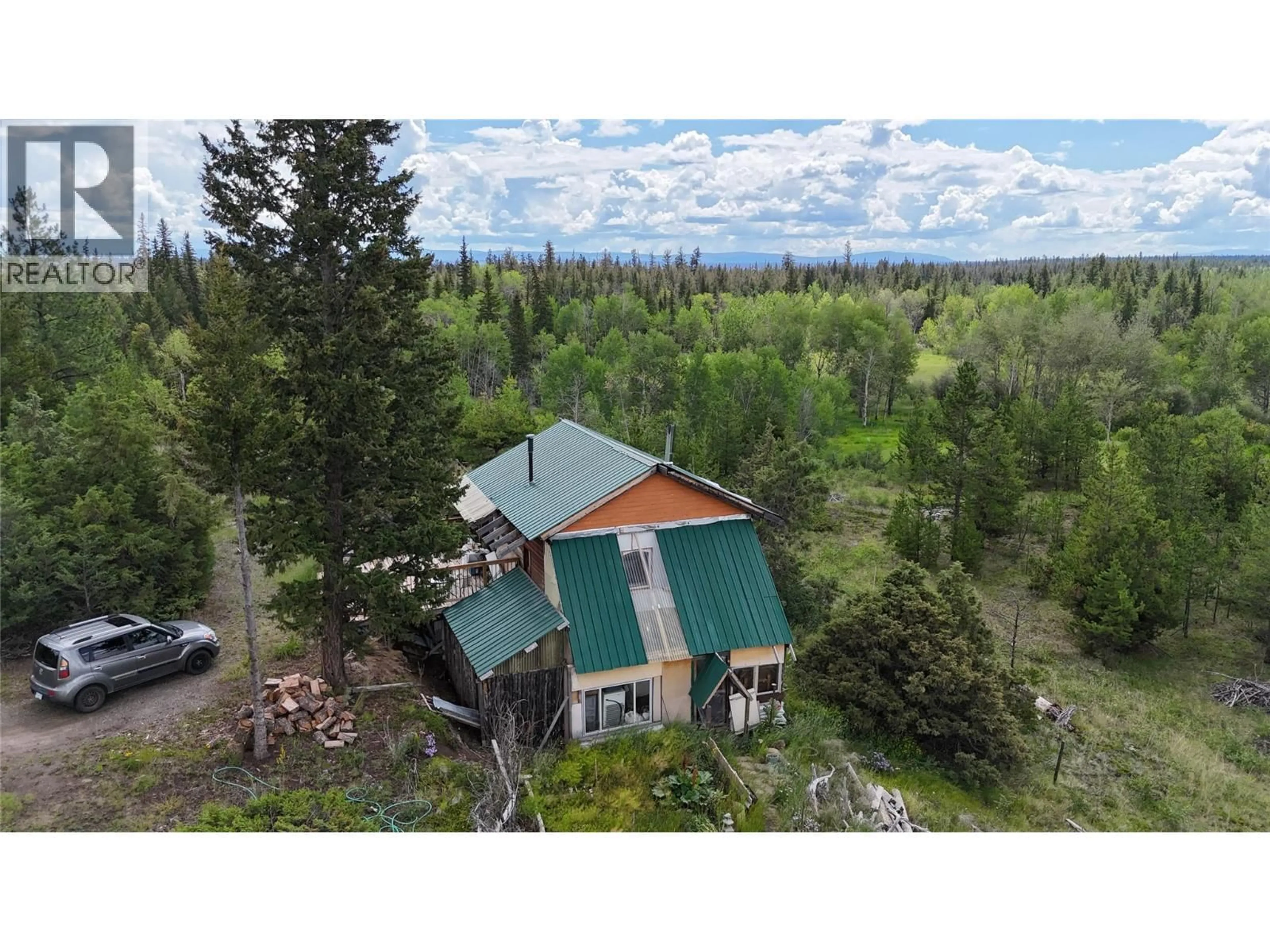 A pic from outside/outdoor area/front of a property/back of a property/a pic from drone, forest/trees view for 1400 CHASM ROAD, 70 Mile House British Columbia V0K1K0