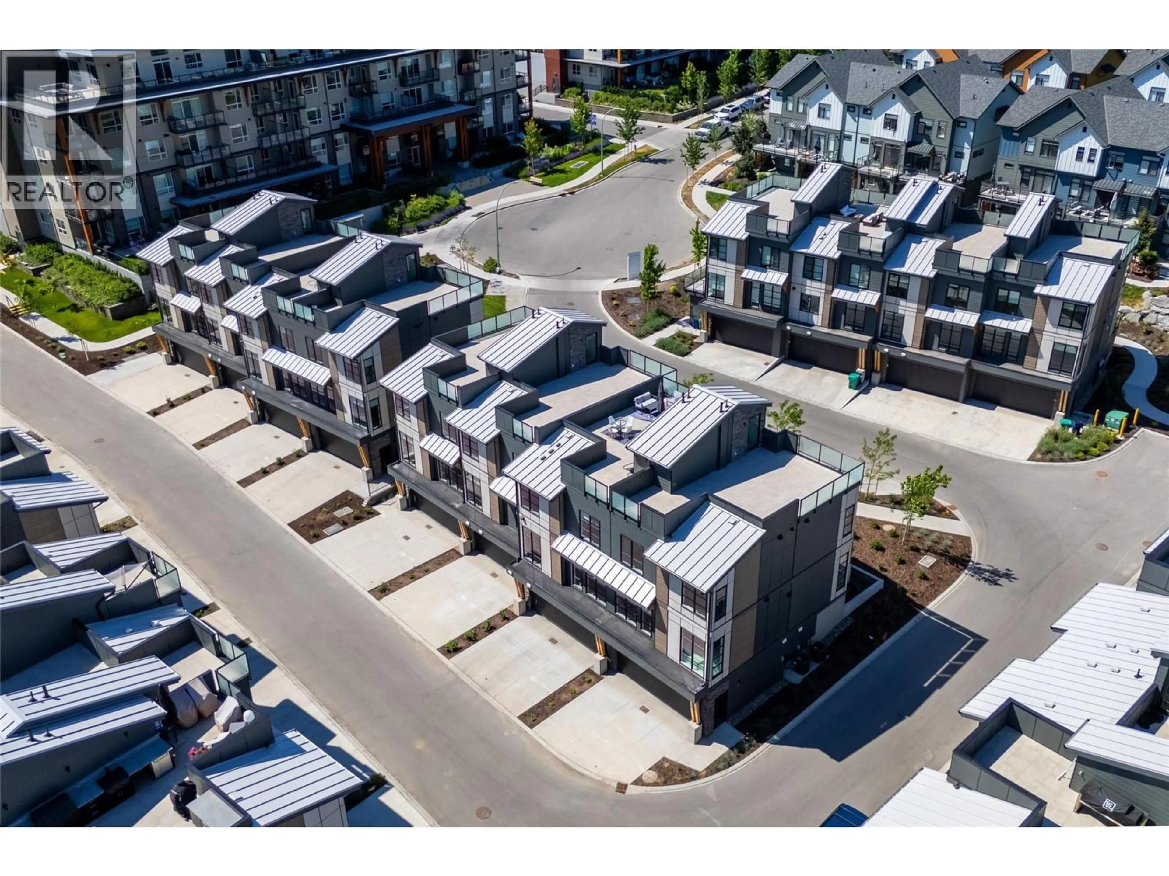 A pic from outside/outdoor area/front of a property/back of a property/a pic from drone, street for 135 - 1455 CARA GLEN COURT, Kelowna British Columbia V1V3B8