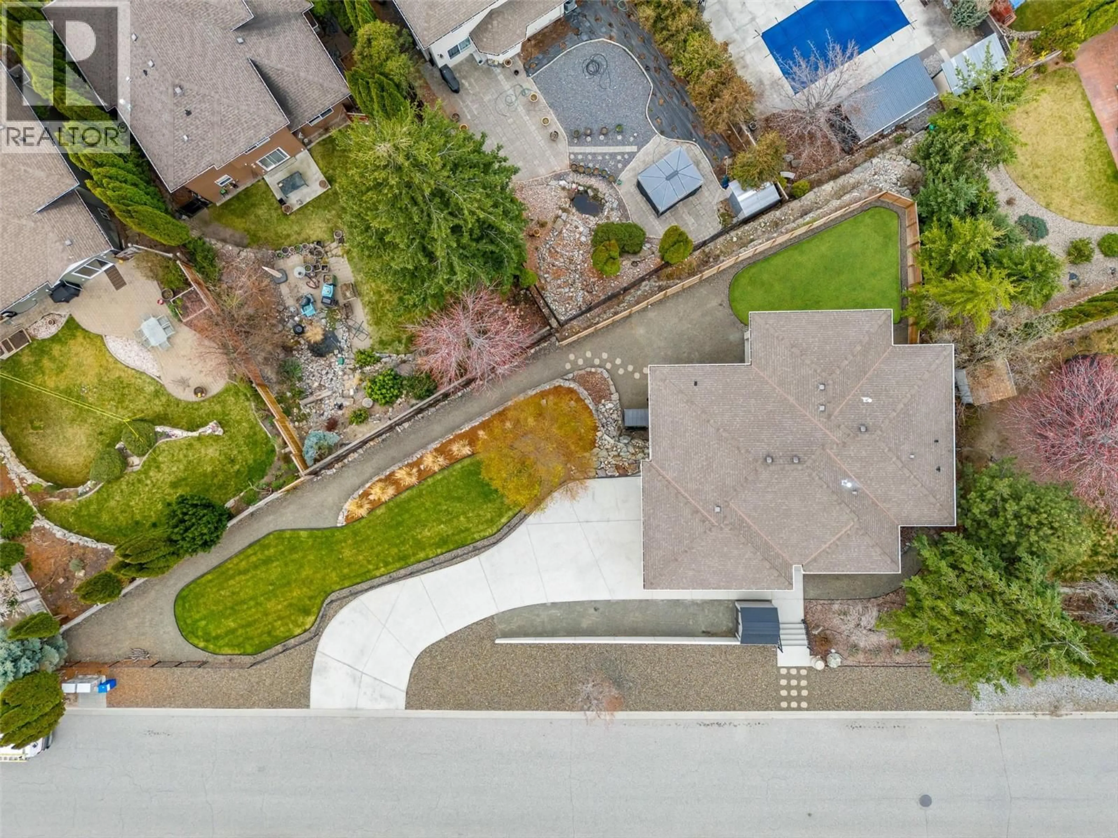 A pic from outside/outdoor area/front of a property/back of a property/a pic from drone, street for 5190 COBBLE CRESCENT, Kelowna British Columbia V1W4Y8