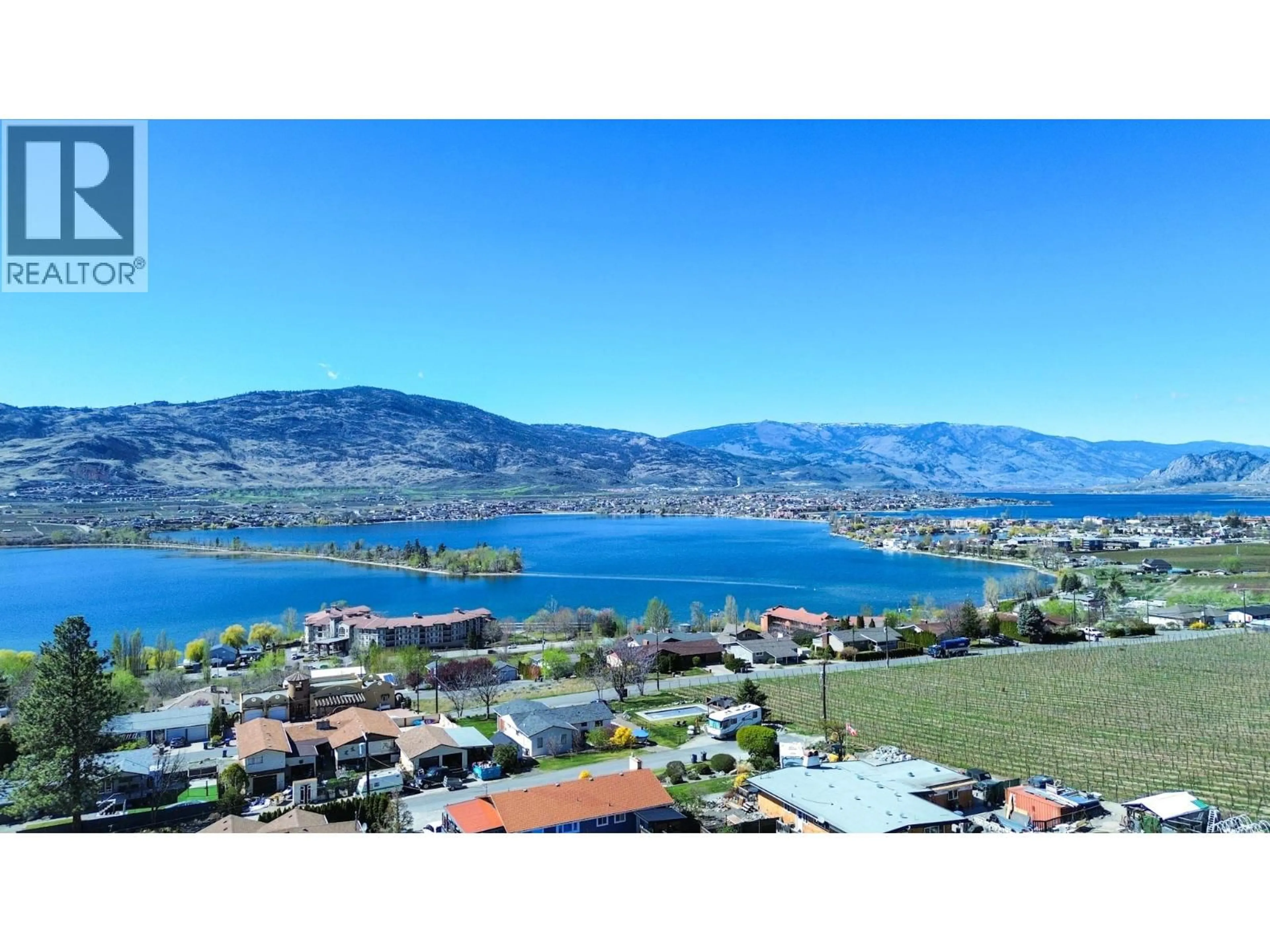 A pic from outside/outdoor area/front of a property/back of a property/a pic from drone, water/lake/river/ocean view for 3826 33RD STREET, Osoyoos British Columbia V0H1V6
