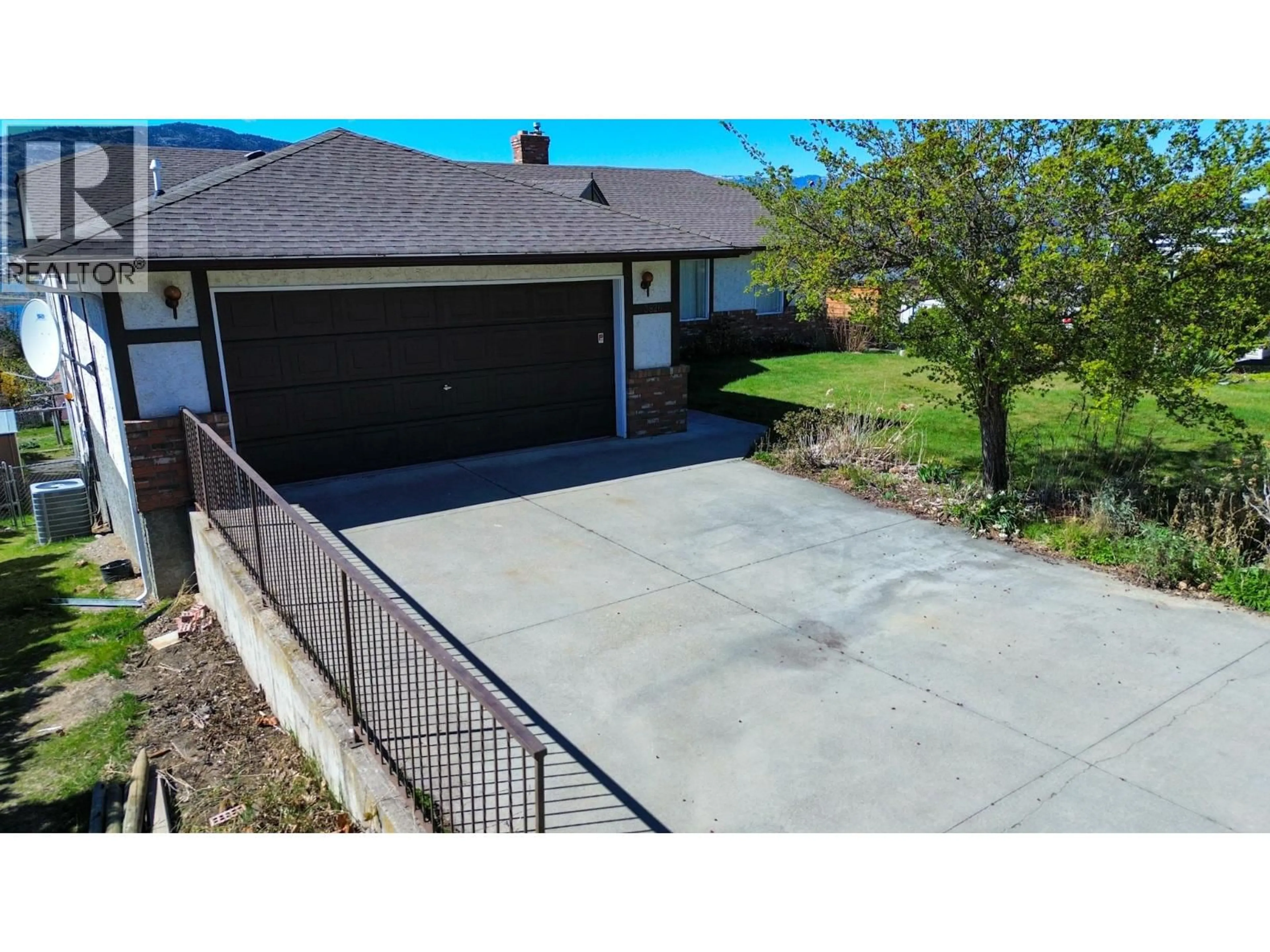 A pic from outside/outdoor area/front of a property/back of a property/a pic from drone, street for 3826 33RD STREET, Osoyoos British Columbia V0H1V6