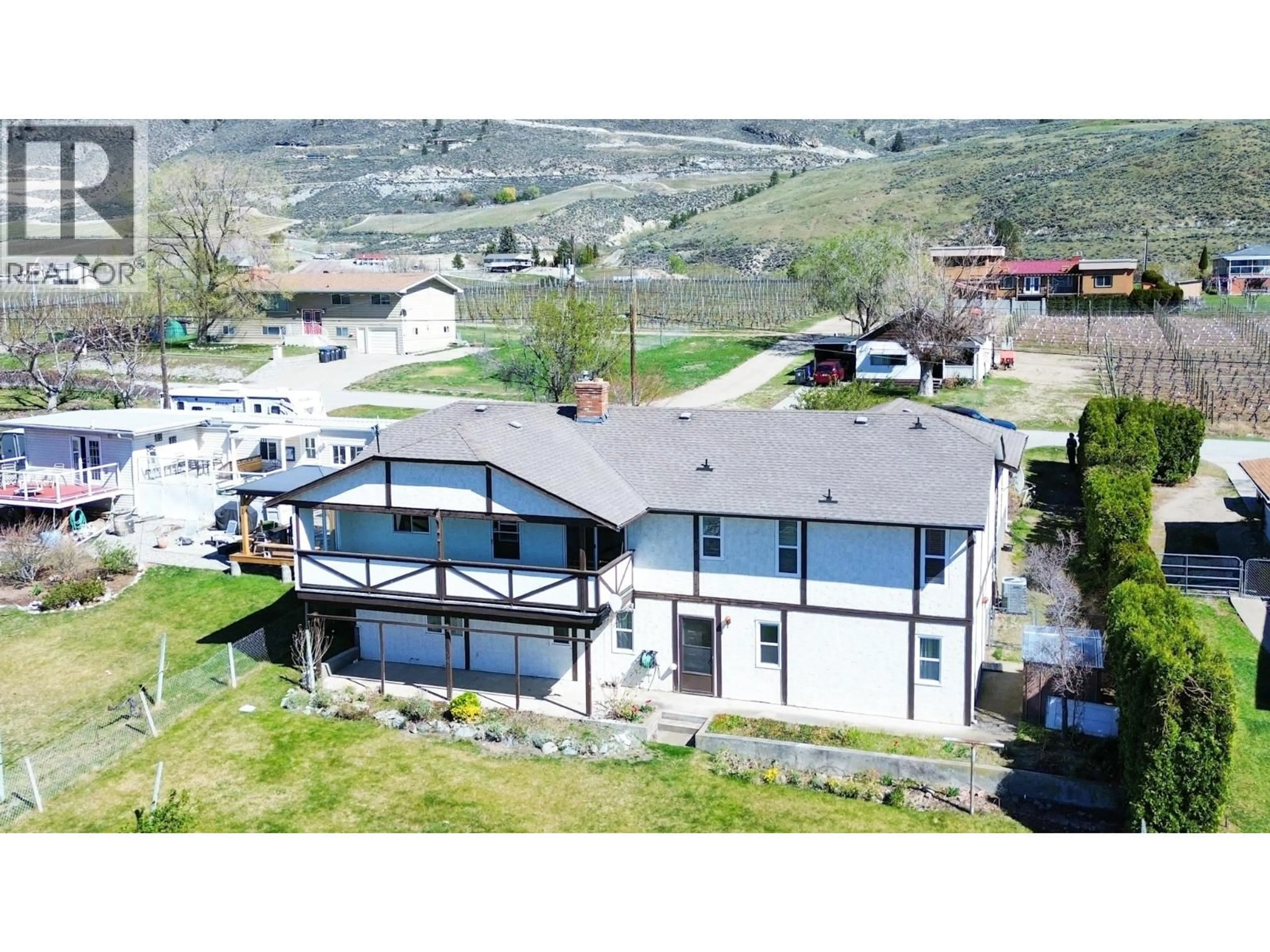 A pic from outside/outdoor area/front of a property/back of a property/a pic from drone, mountain view for 3826 33RD STREET, Osoyoos British Columbia V0H1V6