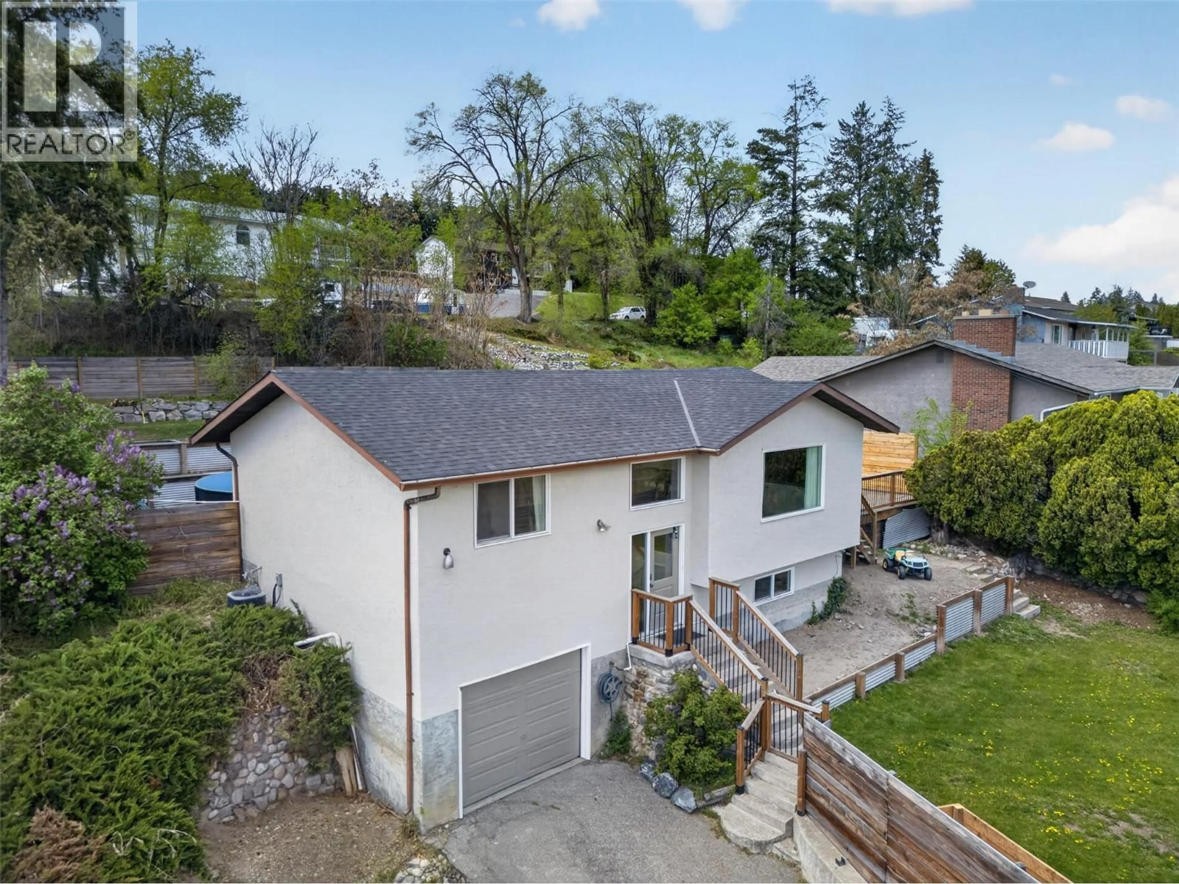 A pic from outside/outdoor area/front of a property/back of a property/a pic from drone, street for 9742 OKANAGAN CENTRE ROAD EAST, Lake Country British Columbia V4V1T6