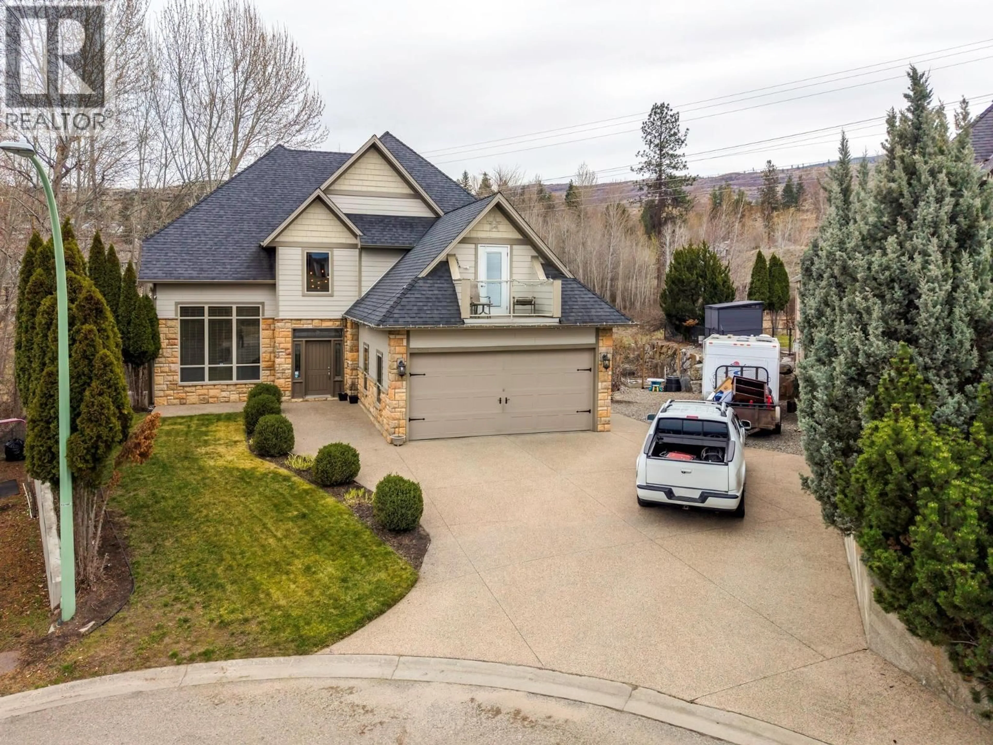 A pic from outside/outdoor area/front of a property/back of a property/a pic from drone, street for 5037 TREADGOLD COURT, Kelowna British Columbia V1W5B4