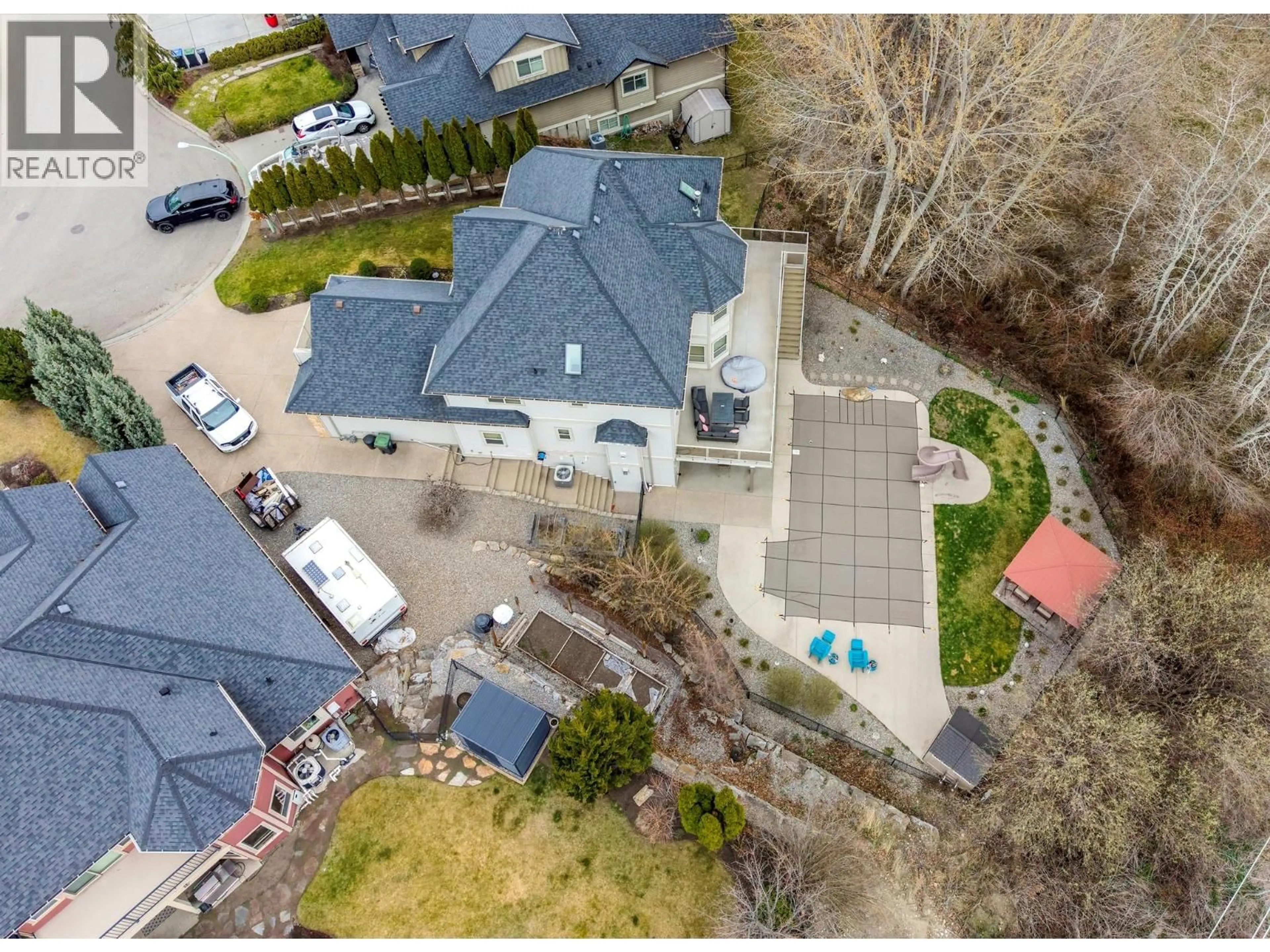 A pic from outside/outdoor area/front of a property/back of a property/a pic from drone, street for 5037 TREADGOLD COURT, Kelowna British Columbia V1W5B4