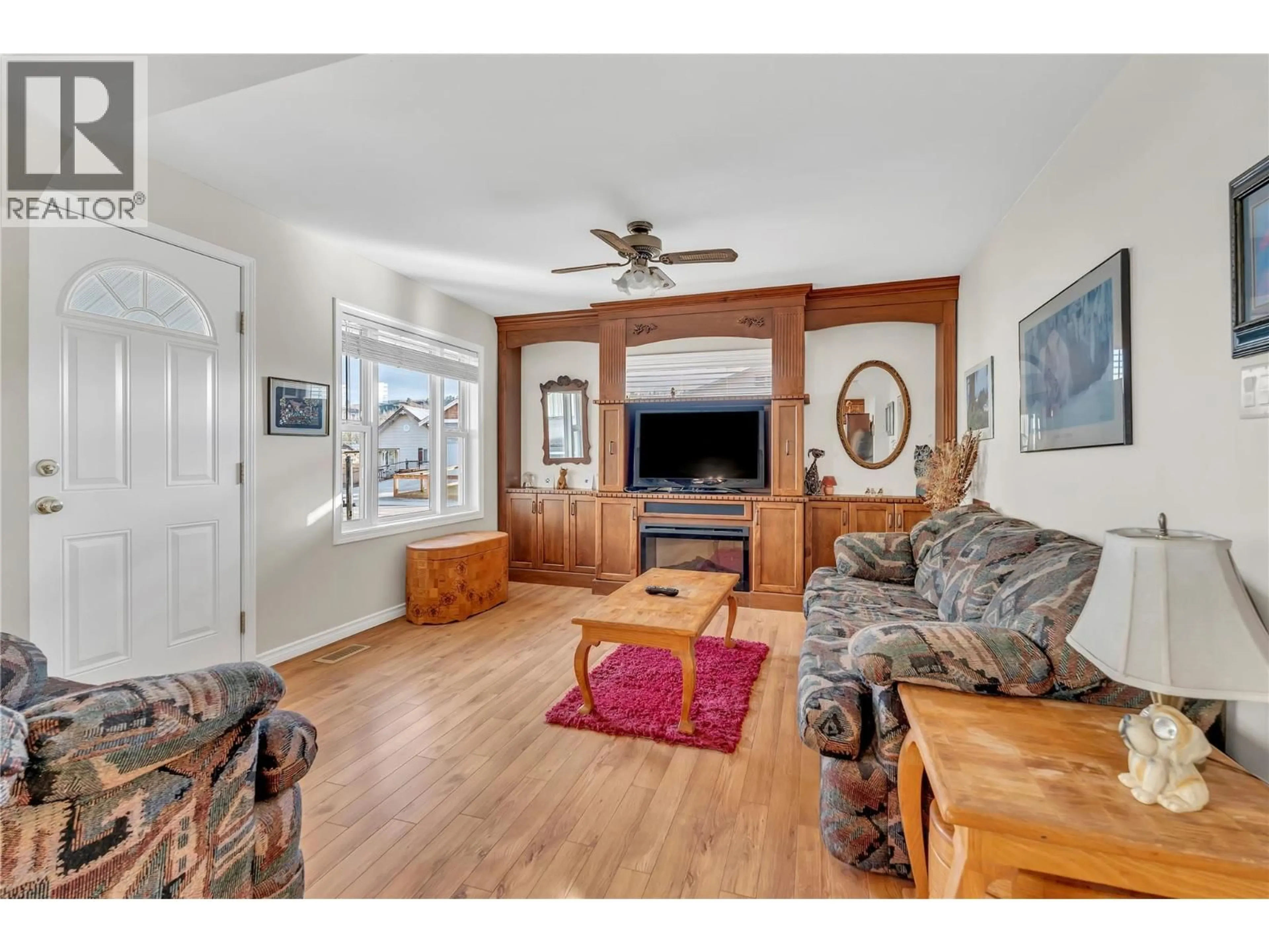 Living room with furniture, wood/laminate floor for 495 AUBURN CRESCENT, Princeton British Columbia V0X1W0