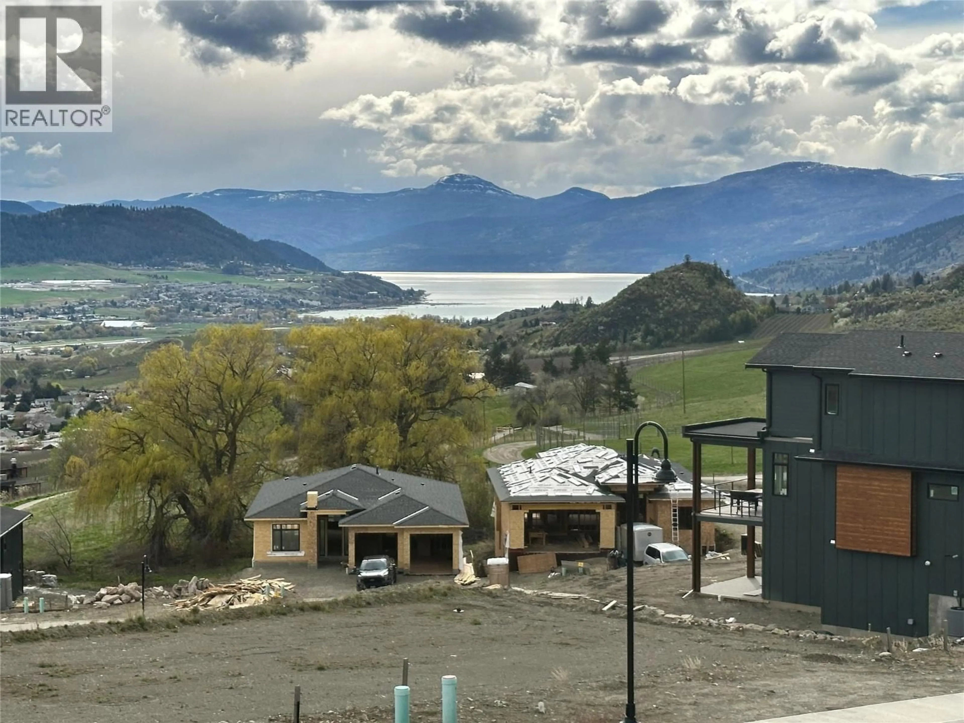 A pic from outside/outdoor area/front of a property/back of a property/a pic from drone, mountain view for 4305 PAINTED TURTLE DRIVE, Vernon British Columbia V1T9W4