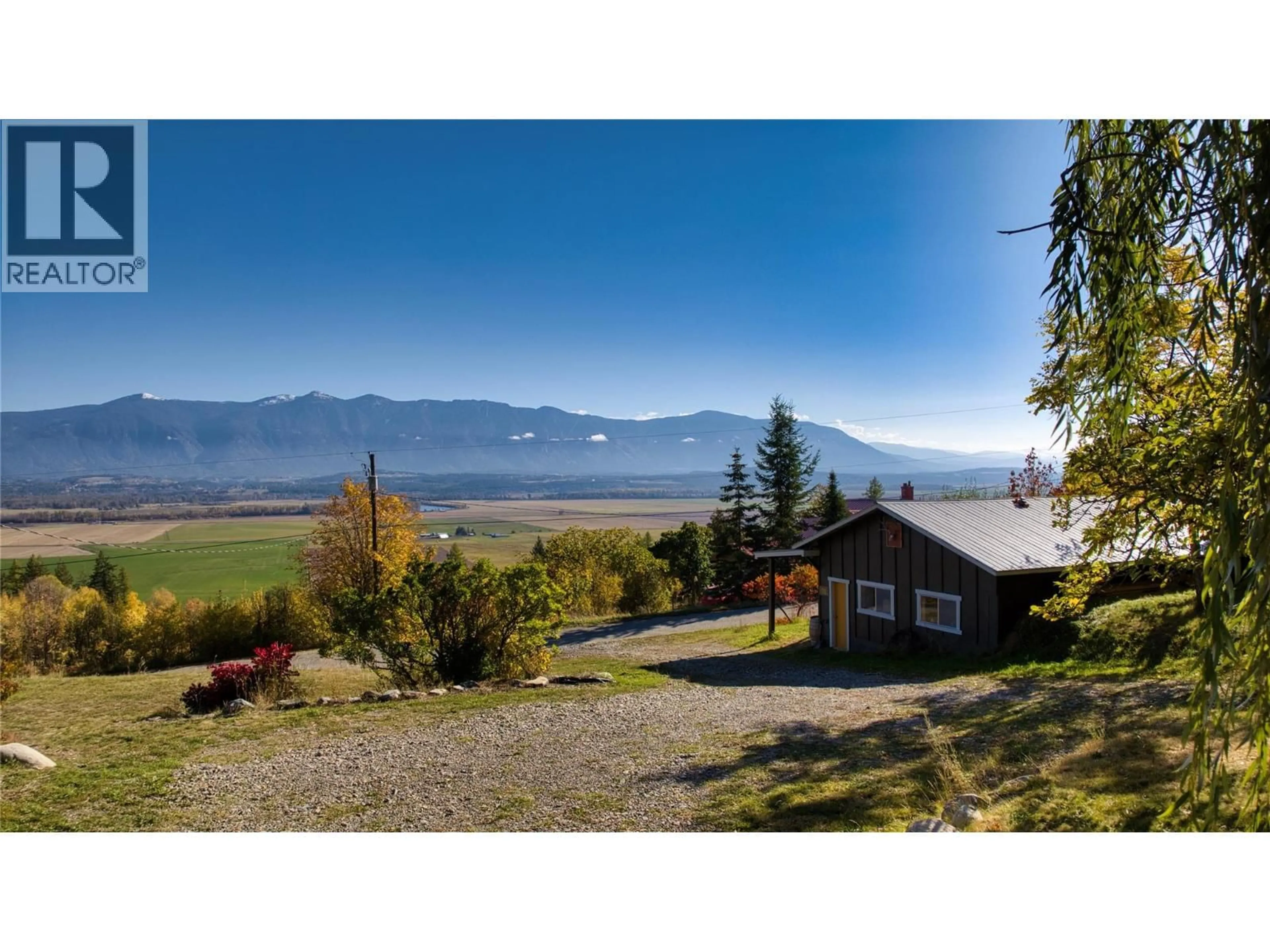 A pic from outside/outdoor area/front of a property/back of a property/a pic from drone, water/lake/river/ocean view for 1017 SIMMONS ROAD, Creston British Columbia V0B1G7