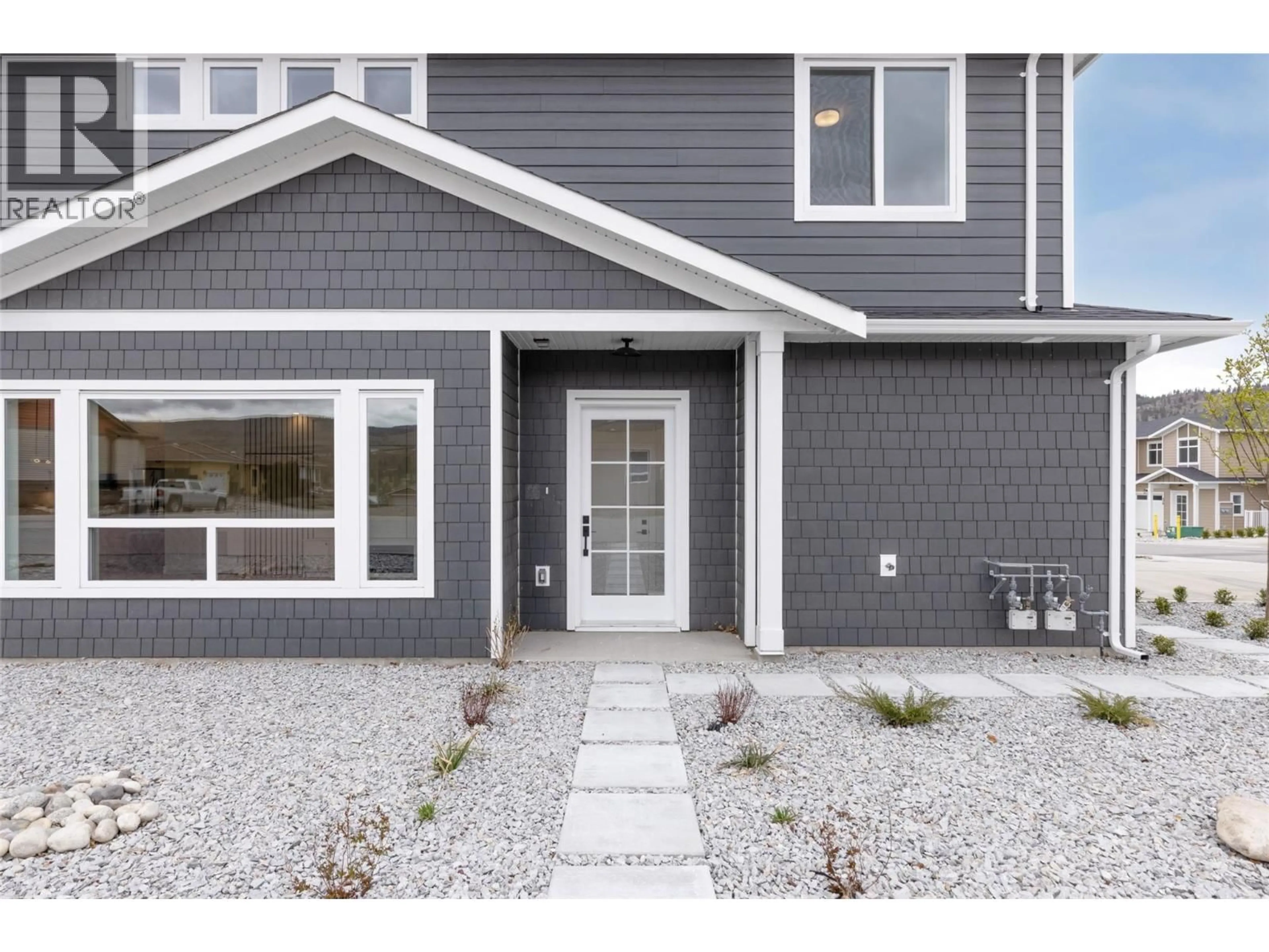 Home with vinyl exterior material, street for 397 CHARDONNAY AVENUE, Oliver British Columbia V0H1T4