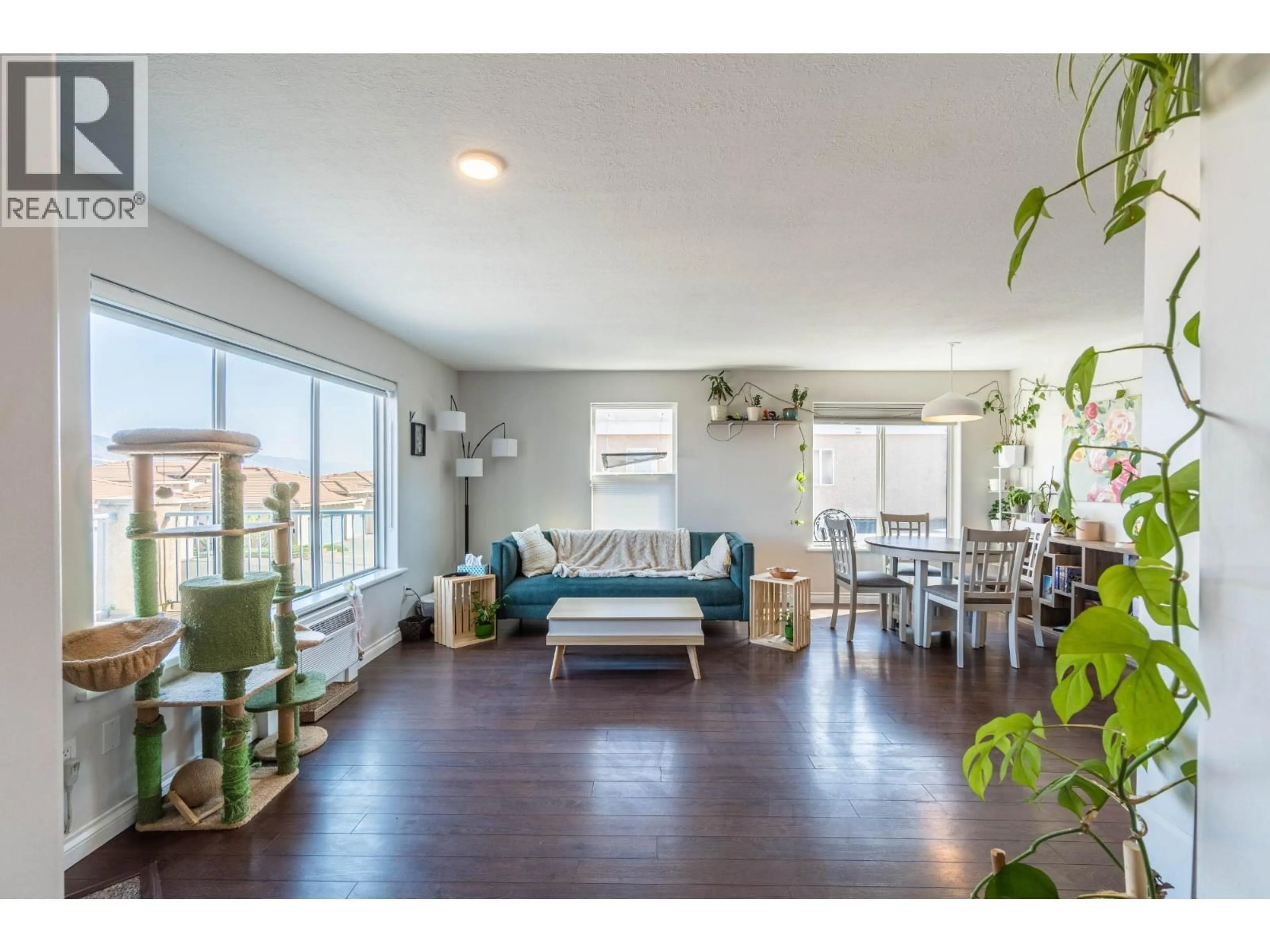 Living room with furniture, wood/laminate floor for 204 - 875 SAHALI TERRACE, Kamloops British Columbia V2C6W8