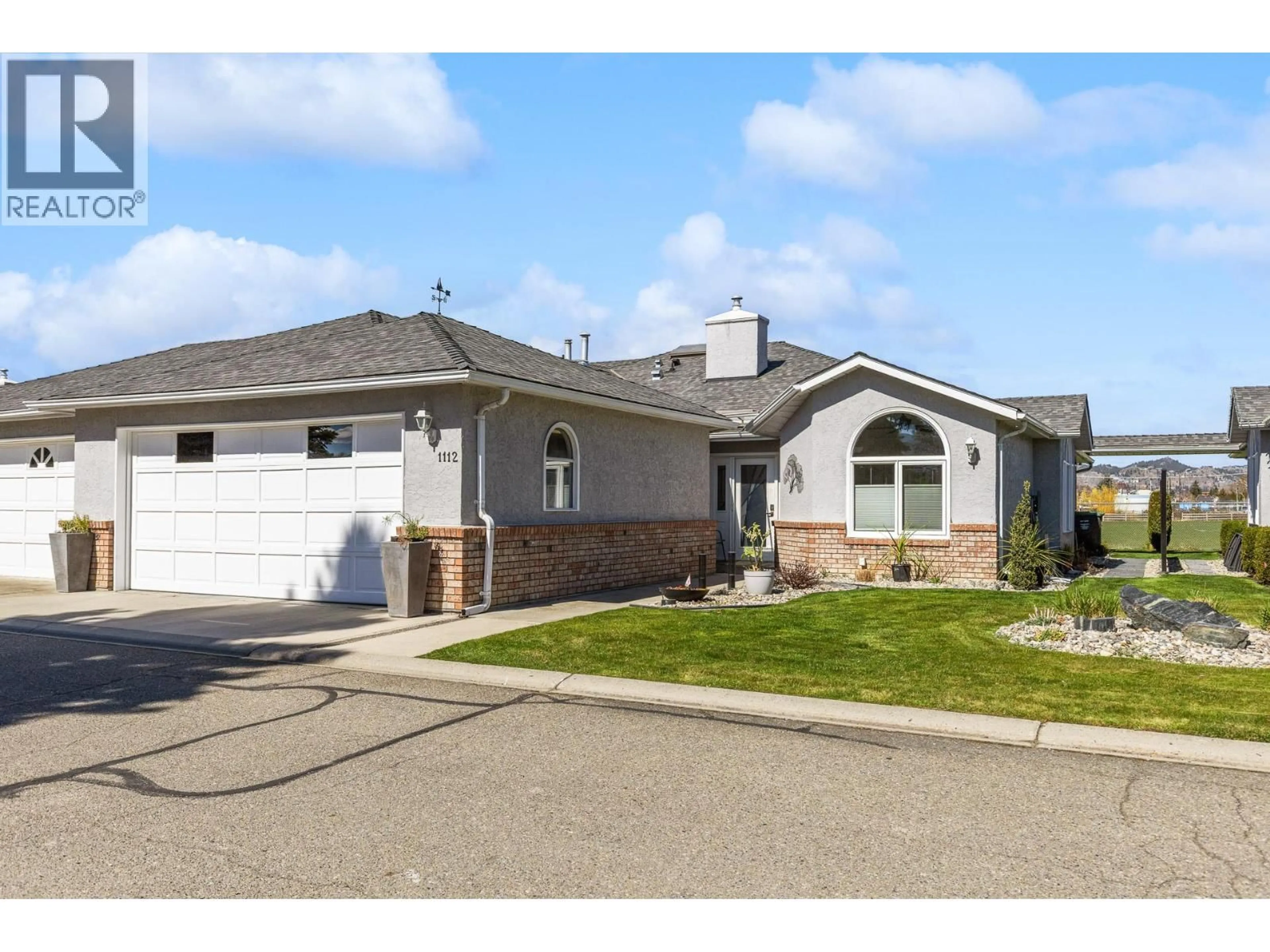 Home with vinyl exterior material, street for 1112 LANFRANCO ROAD, Kelowna British Columbia V1W3W5