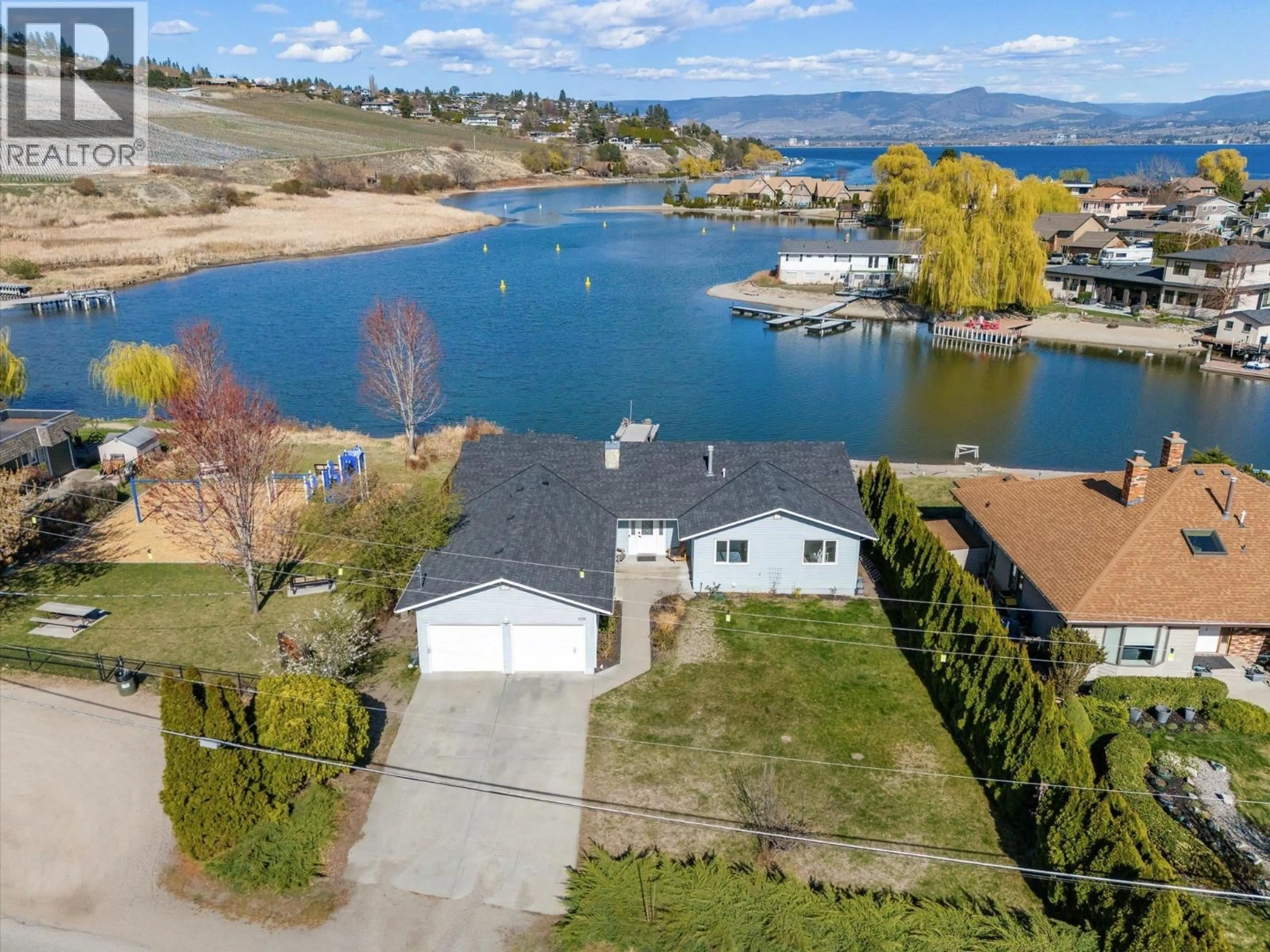 A pic from outside/outdoor area/front of a property/back of a property/a pic from drone, water/lake/river/ocean view for 1428 GREEN BAY ROAD, West Kelowna British Columbia V4T2B8