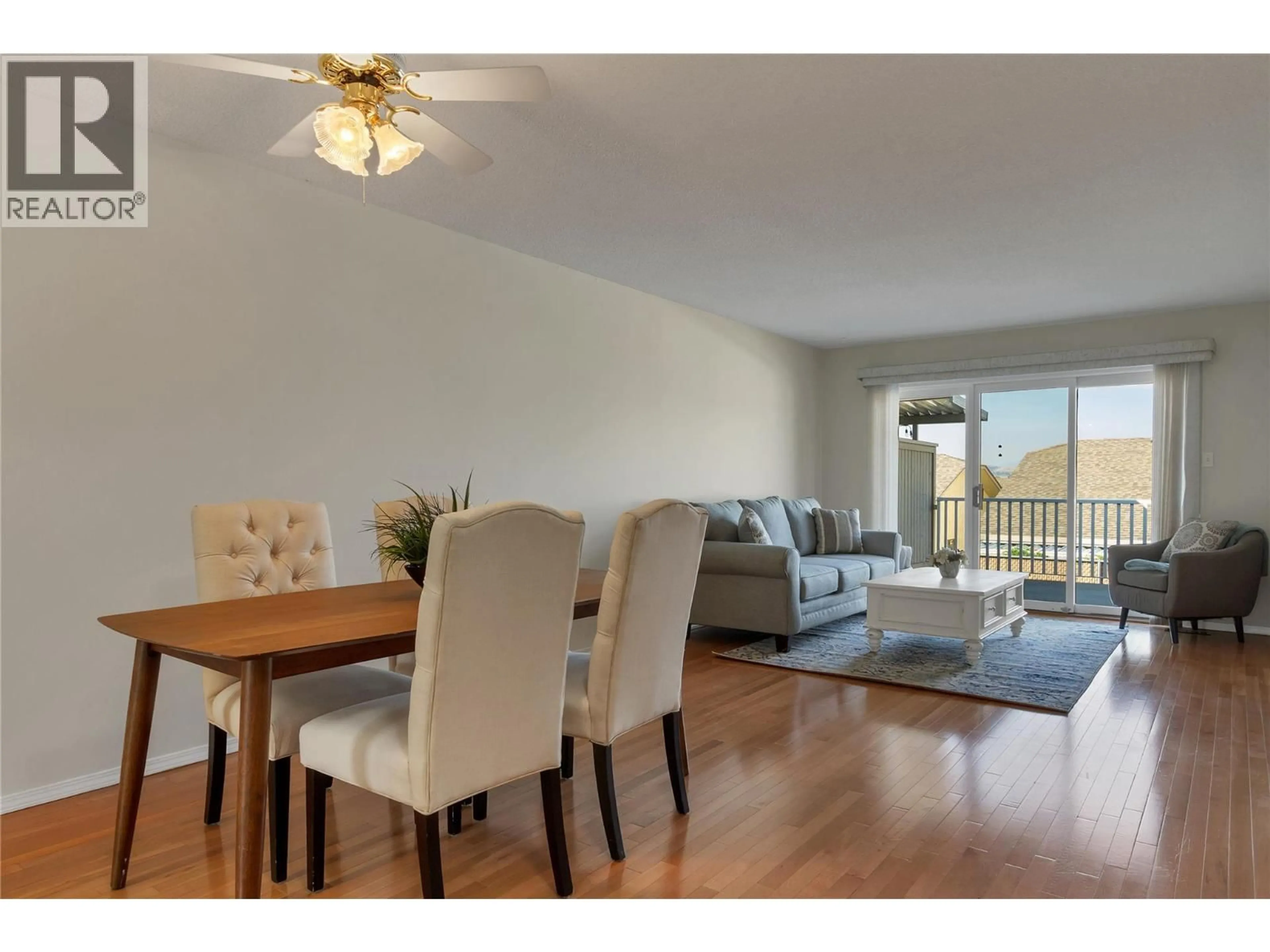 Living room with furniture, wood/laminate floor for 10 - 3906 PLEASANT VALLEY ROAD, Vernon British Columbia V1T4L9