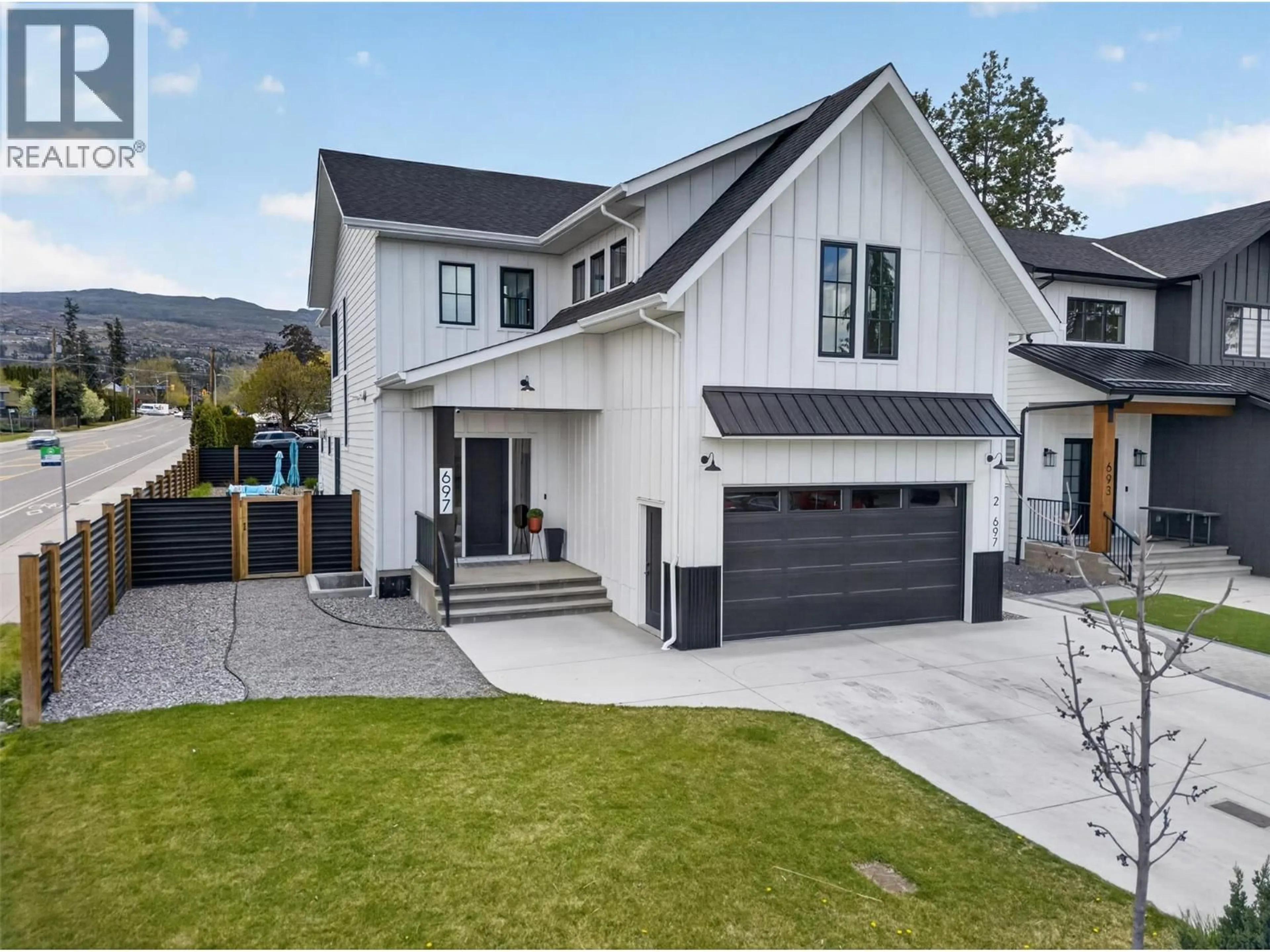 Home with vinyl exterior material, mountain view for 697 BALSAM ROAD, Kelowna British Columbia V1W1C1