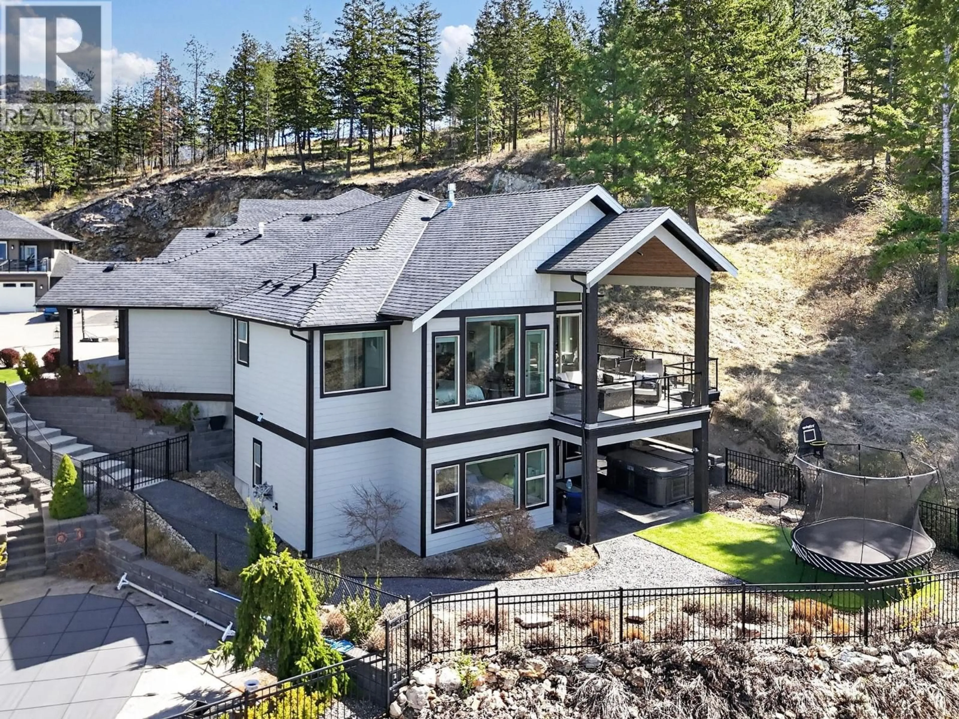A pic from outside/outdoor area/front of a property/back of a property/a pic from drone, mountain view for 414 PRESTWICK STREET, Kelowna British Columbia V1P1T1