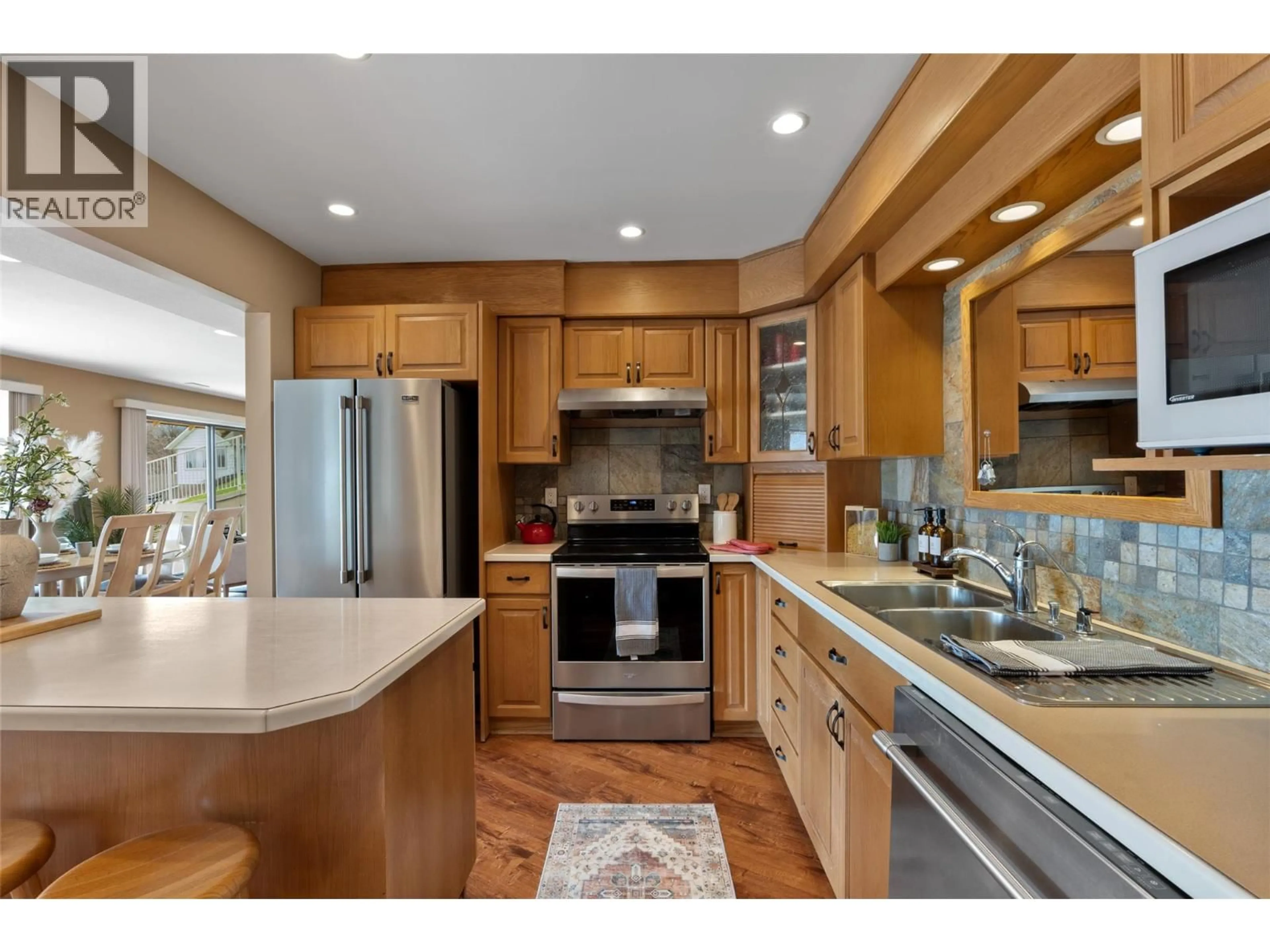 Open concept kitchen, wood/laminate floor for 287 CONNAUGHT ROAD, Kamloops British Columbia V2C1G5