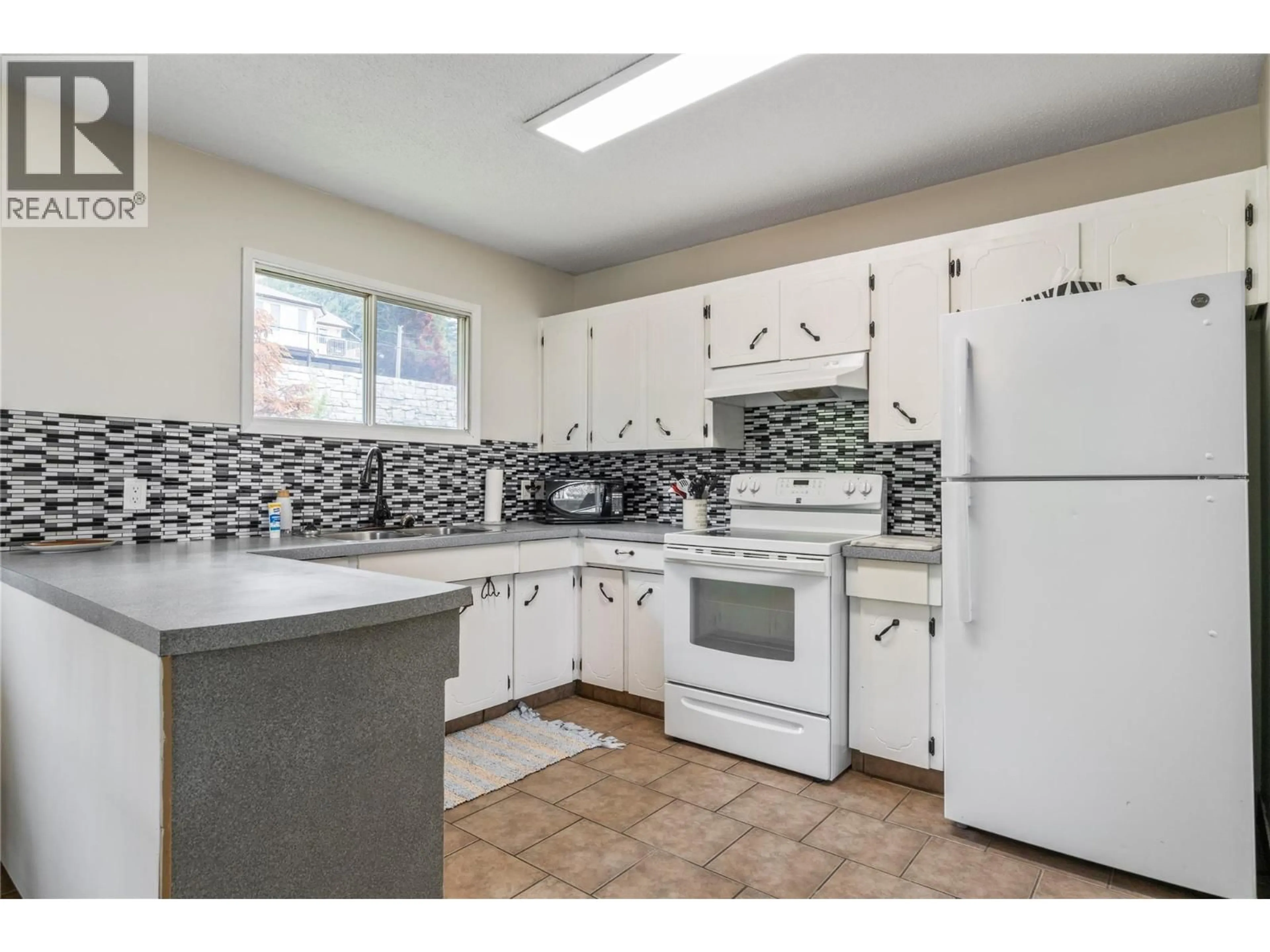 Standard kitchen, ceramic/tile floor for 5271 CHASEY ROAD, Celista British Columbia V0E1M6