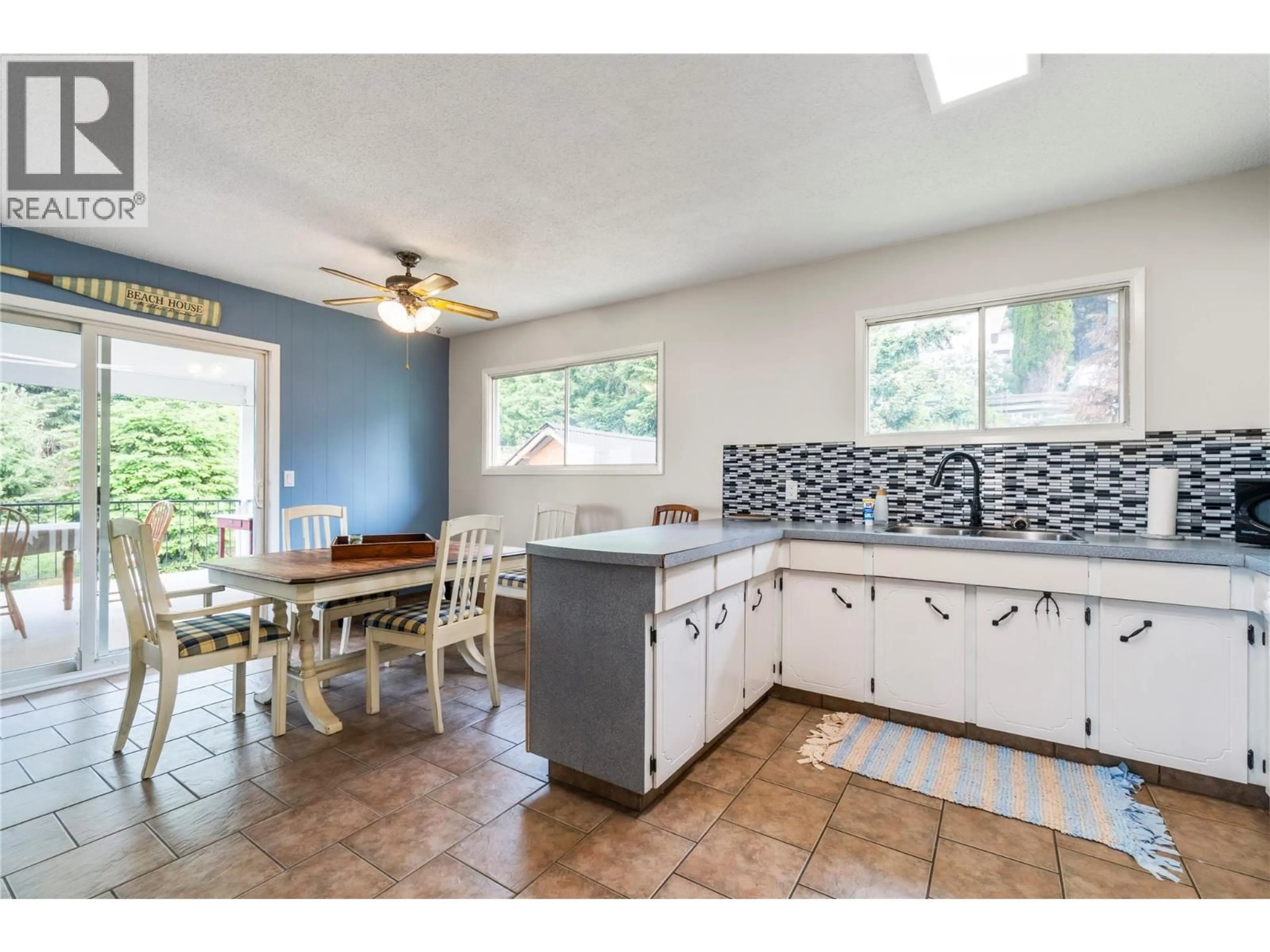 Open concept kitchen, ceramic/tile floor for 5271 CHASEY ROAD, Celista British Columbia V0E1M6